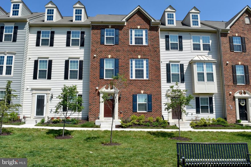 Beautiful interior townhouse w/ 2 car garage, 4 bedrooms, 3.5 baths, hardwood, wall-to-wall carpet, huge gourmet kitchen with island.  Separate tub in master bath, rear deck off kitchen. Close to food, shopping and commuter routes.