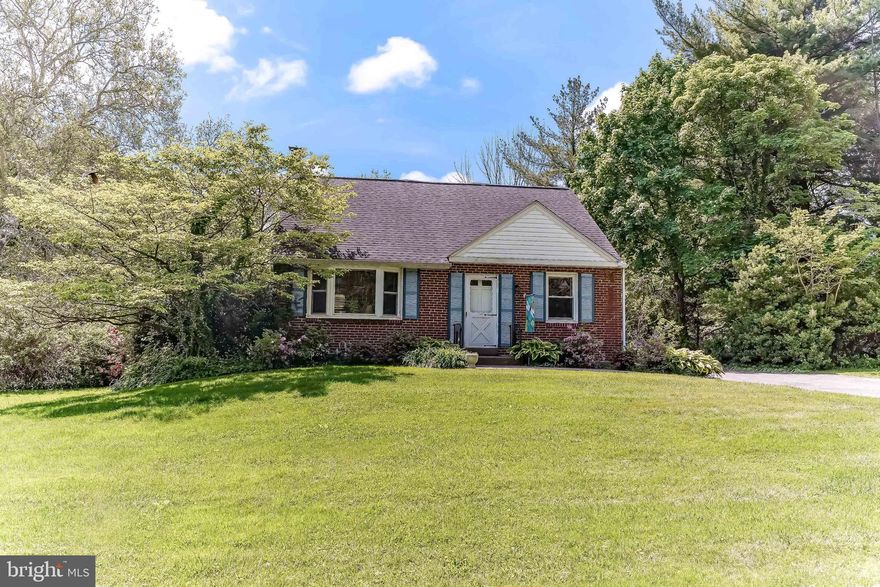 Charming  4 Bedroom, 2 Bath Brick Cape situated on an incredible lot in Wallingford-Swarthmore School District. The main floor hosts a sun-filled Living Room with bay window that flows into the Dining Room, and galley Kitchen with ample cabinetry, two Bedrooms (one  is also currently being used as main floor laundry for convenience), Full Bath with large fully tiled shower with bench, and a Spectacular All-Season Sunroom boasting walls of windows that showcase the magnificent Back Yard. Step outside from the sunroom onto the huge custom paver patio and into the private lot bordered by mature plantings, perfect for outdoor entertaining, gardening, or simply enjoying this beautiful, tranquil setting. The second floor offers two additional Bedrooms and Full tile Bath with cast iron tub.
This home also features a full partially finished Basement and an Oversized Detached Two-Car Garage with 10+ ft. ceilings with an abundance of additional storage.
Fantastic Location! Conveniently located just 20 minutes from The Philadelphia International Airport and walking distance from community parks and all of the wonderful arts, shopping, and dining of Downtown Media!