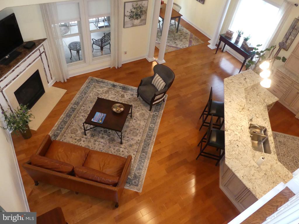 Impeccably maint 3BD/3Ba EOG Villa in 55+ Comm. Stunning foyer w/2 tray ceil's welcome you into the home. Open flr plan w/immense granite gourmet kit. New Bosch & Bertazzoni Italian Appl's. Maple flrs on main lvl create a warm comfortable feeling. Fam rm features a corner vented gas fireplace w/hearth, mantle & granite top. Breakfast area & dining rm offer ample space for casual meals. Slider from dine rm to screened-in patio & backyard seamlessly connect indoor & outdoor living spaces. Primary bedrm w/tray ceiling, huge glass block & tile shower along w/dbl bowl granite sinks & w-in closet w/organizer make this a superior space. A 2nd main lvl bedrm/office/flex rm w/full bath is a versatile space ideal for guests. Upper lvl features the catwalk overlook, 3rd bedrm, loft area & utility closet. Recessed lites are in abundance in home. 1st flr laundry rm w/utility tub. Garage w/epoxy flr & storage cab's. Gutter helmets. Furnace/A/C are on a yearly maint program.