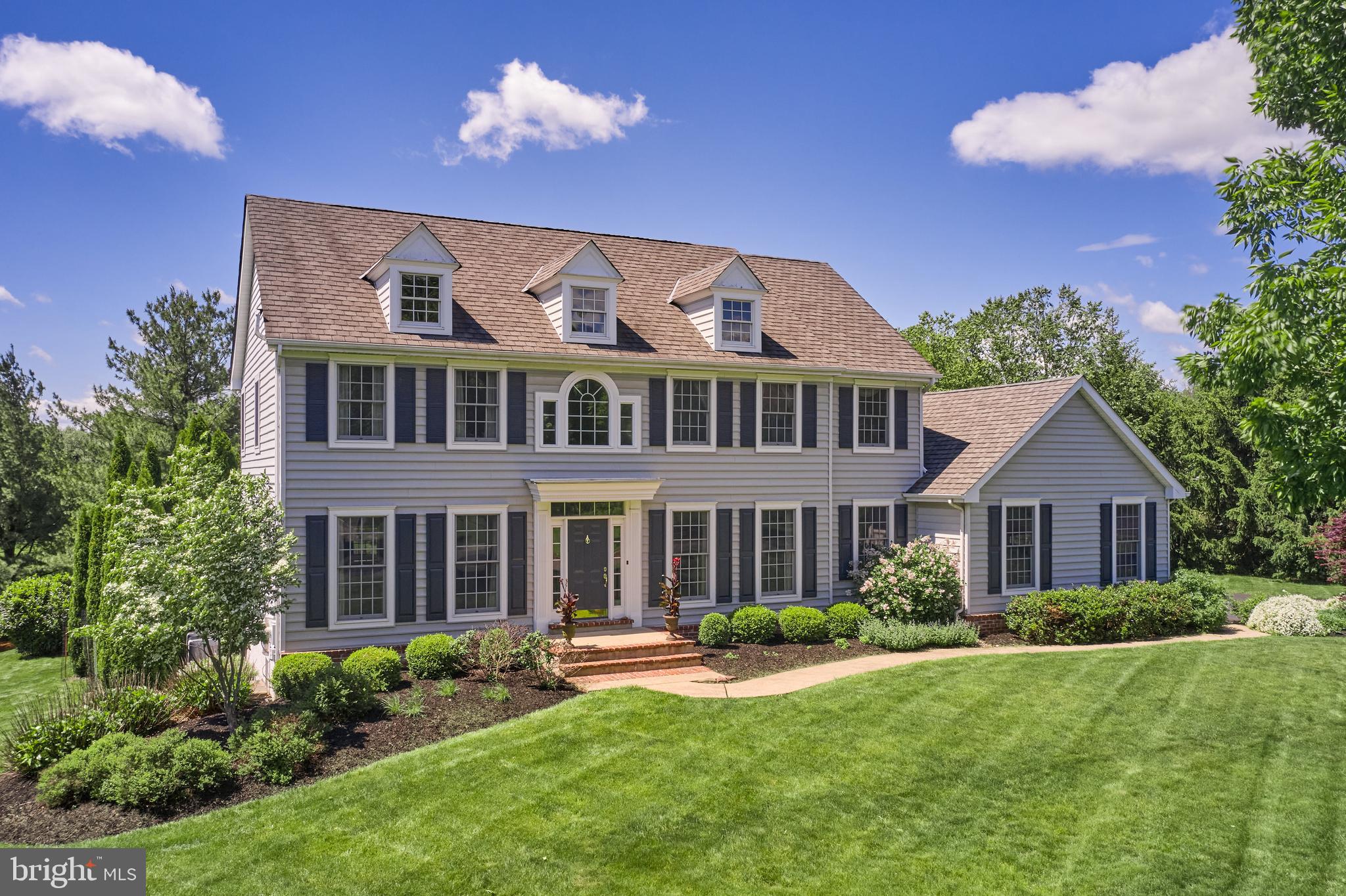 This home has it all! Nestled in the highly sought-after Fox Hunt Estates, and set on nearly 1.4 beautifully landscaped acres, this classic Colonial offers the perfect blend of timeless elegance and modern luxury—ideal for both everyday living and exceptional entertaining.
Step inside to a graceful first floor featuring Brazilian cherry hardwood floors, decorative crown moulding, and wainscoting throughout. The white gourmet kitchen is a dream, equipped with Sub-Zero and Wolf appliances, Carrara marble countertops, and a layout that flows into the sunny, casual dining area overlooking the beautiful backyard. A formal dining room, formal living room, den with fireplace, home office, mudroom and powder room complete the first floor.
Upstairs, the primary suite impresses with a tray ceiling, dressing room and a luxurious bath complete with soaking tub, and ample closet space. The additional three bedrooms are generously sized and perfect for family or guests.
The finished basement expands your living space, complete with a full bath featuring heated floors—ideal for a guest suite, gym, or media room.
The best part may be the backyard, which features not only a covered, lighted deck and patio, but also a sparkling in-ground saltwater pool and spa. Sipping your morning coffee or winding down in the evening on the covered patio feels like relaxing in your own private nature preserve—surrounded by birdsong and peaceful stillness. The lush, mature trees and landscaping offer shade, beauty and privacy.
Car enthusiasts will appreciate the three-car garage outfitted with Swisstrax flooring, two EV charging outlets, a heater, gladiator tracks organization and ample storage.
This home truly has it all and is move-in ready! See the list of Special Features for more.