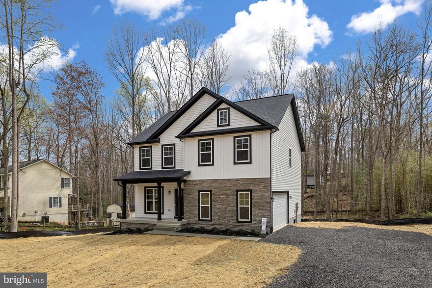 This stunning new construction home in Lake Wilderness offers a perfect blend of modern comfort and community charm. With 4 spacious bedrooms and 2.5 baths, the interior features elegant crown moldings, recessed lighting, and quartz countertops that create a warm and inviting atmosphere. Step outside to enjoy a beautifully landscaped lot of over half an acre, backing to serene trees, providing a peaceful retreat. The community boasts fantastic amenities, including a pool, clubhouse, and picnic areas, ideal for leisure and recreation. Historic Battlefield areas and the Riverbend School District enhance the neighborhood's appeal, making it a wonderful place to call home. With easy access to major roads and public services, this property is not just a house; it's a lifestyle waiting for you to embrace.