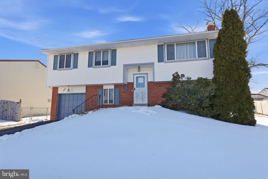 Charming 3-Bedroom Home in a Desirable Neighborhood - Welcome to this 3-bedroom, 1.5-bath home offering comfort, flexibility, and great space for everyday living and entertaining. The inviting living and dining room combination creates a seamless flow—perfect for hosting family and friends.  The lower level provides added versatility with a cozy family room featuring a fireplace with brick surround, along with a bonus room ideal for a home office or potential fourth bedroom.  Enjoy indoor-outdoor living with sliding glass doors that lead to a fenced-in backyard—perfect for relaxing, entertaining, or pets.  Additional highlights include a one-car garage, partial brick front for added curb appeal, and a convenient location close to parks, recreation, shopping, and transportation.