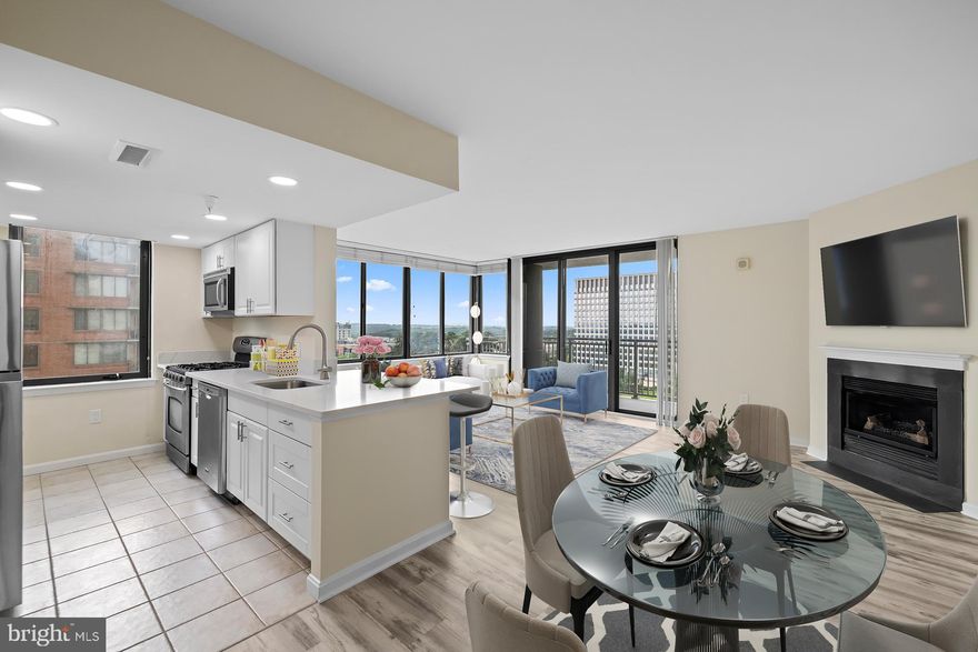 Beautifully updated, move-in-ready 2-bedroom, 2-bath corner unit offers 1,419 square feet of bright, comfortable living space in a modern high-rise setting.

The kitchen has been updated with new quartz countertops and cabinets.  It has stainless steel appliances—perfect for everyday cooking or hosting friends. You’ll also love the new vinyl flooring, fresh paint, and updated lighting throughout.

Open layout connects the living and dining areas, making the space feel airy and great for entertaining—or just relaxing at home. Just off the kitchen, the cozy family room with a fireplace and glass doors is the perfect spot to unwind at the end of the day.

The primary suite offers a spacious walk-in closet and a private attached bath, creating a comfortable retreat. Thoughtful touches like recessed lighting and window treatments add to the warm, welcoming vibe.

Step outside onto your private balcony and take in the city views, or enjoy the community’s outdoor spaces with a BBQ area, beautiful landscaping, a picnic area, playground, and a resort-style pool.

You’ll also appreciate the convenience of 2 assigned parking spaces in a secure, covered garage with direct building access, plus 24-hour security and a friendly lobby desk for extra peace of mind. Community amenities include a fully equipped fitness center, concierge services, and community rooms perfect for gatherings.

Only a few blocks from the North Bethesda Metro and Pike and Rose.  This home combines comfort, style, and convenience in one great package.

Come see what makes this place so special—you will feel right at home.