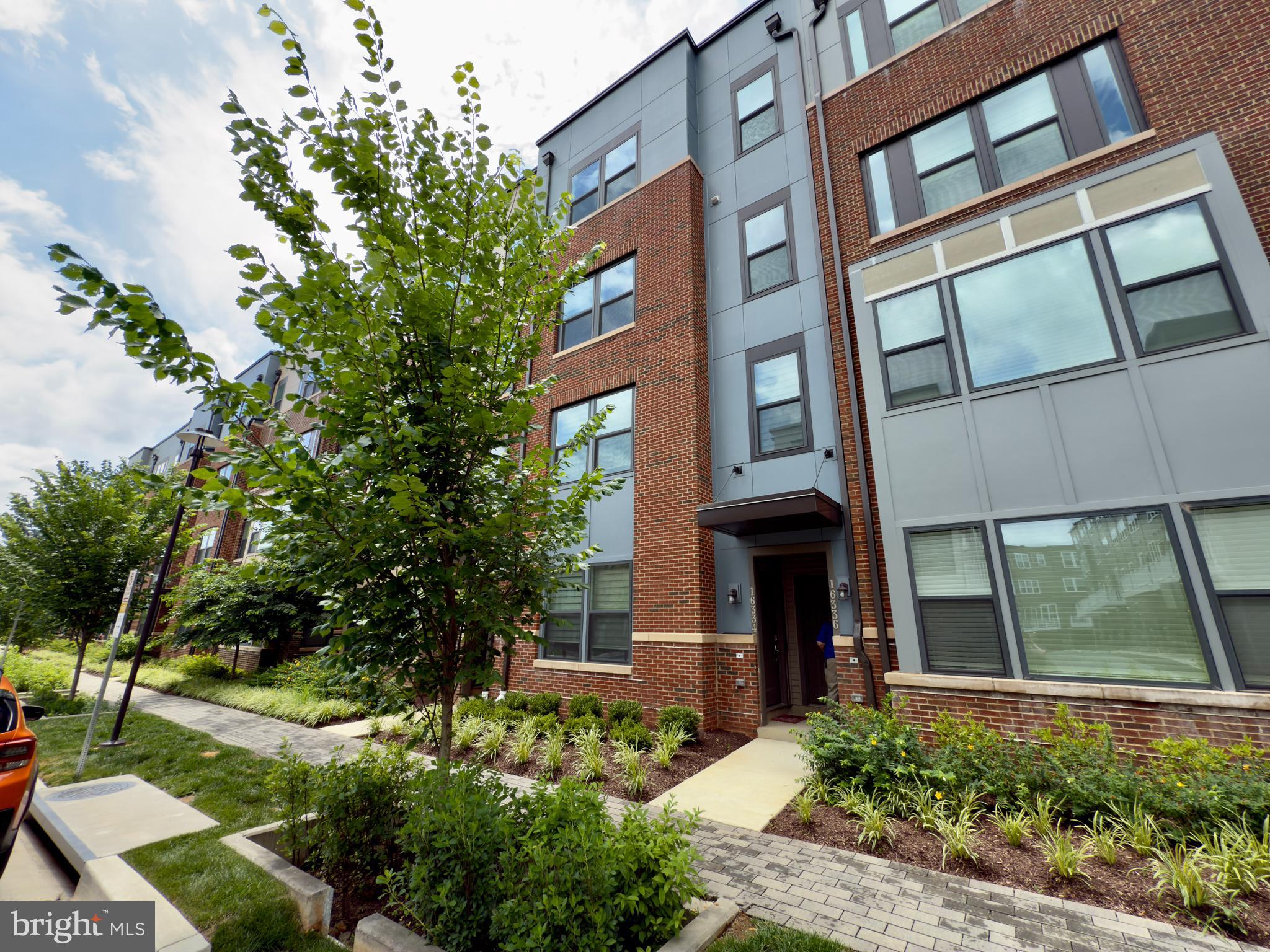GREAT PRICE!!! Welcome to this stunning top-level condo townhome in Rockville, offering the perfect blend of luxury, space, and convenience. Step inside to an expansive open-concept main level, where the living, dining, and kitchen areas flow seamlessly—perfect for entertaining or everyday comfort. The chef’s kitchen is a true showstopper, featuring sleek quartz countertops, premium GE Profile stainless steel appliances, a massive center island, and stylish LVP flooring throughout. A convenient powder room and deck complete the main level, ideal for indoor-outdoor living. Upstairs, the spacious primary suite offers a serene retreat with a large walk-in closet, dual vanities, a private water closet, and a walk-in shower with a built-in step. Two additional bedrooms including one with its own walk-in closet provide ample space for guests, family, or a home office. A second full bathroom with a double-sink vanity, an upper-level laundry room, and a separate utility room add to the home’s thoughtful layout. Additional highlights include a one-car attached garage, a private driveway, and HOA-permitted guest street parking. Enjoy access to the community’s beautiful clubhouse and swimming pool just a short stroll away, as well as nearby shops for added convenience. Located in a vibrant, amenity-rich neighborhood just a few turns from I-200 and within walking distance to the Metro, this residence is a commuter’s dream.