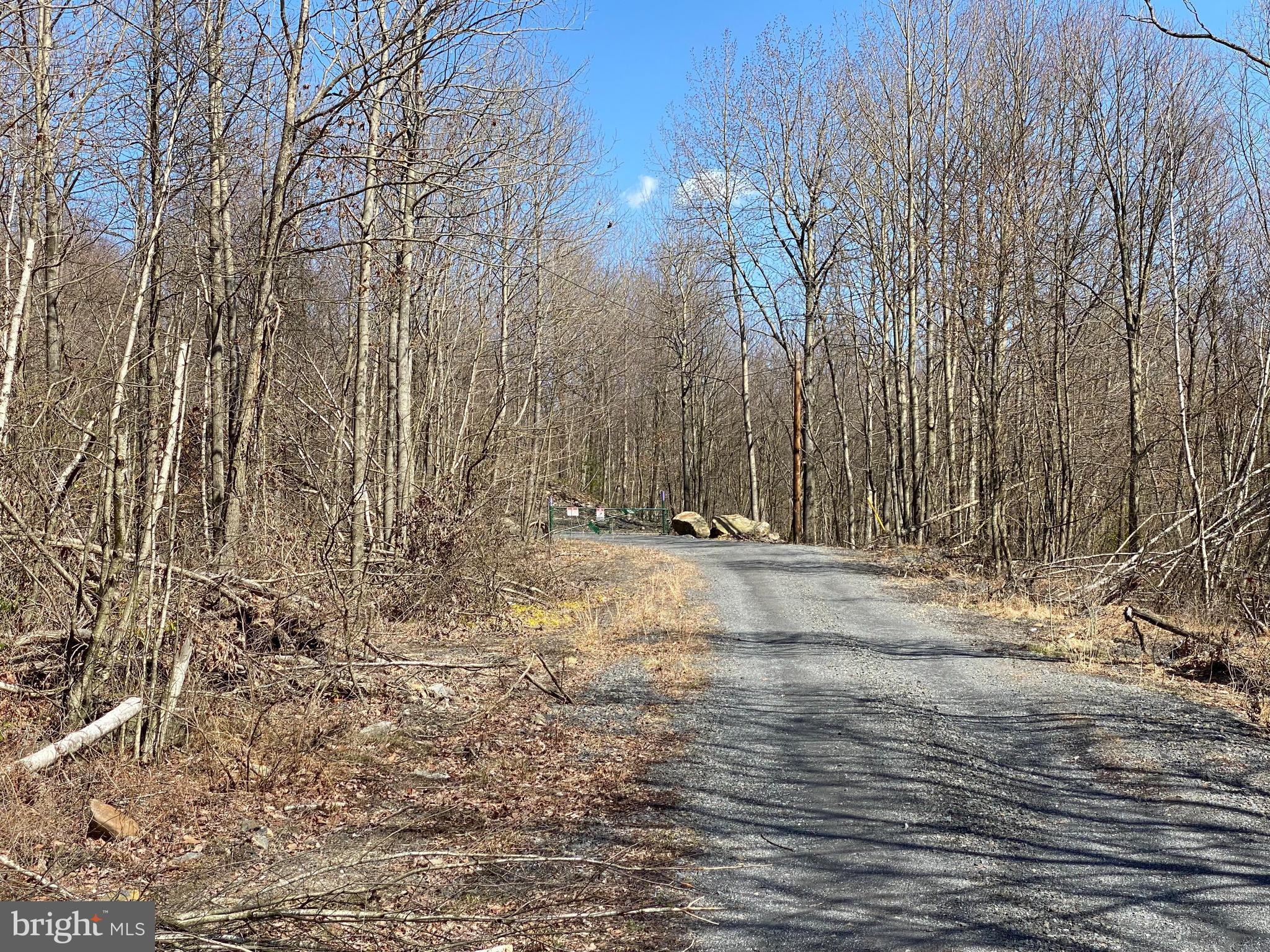 Rare, hard to find 232 acres with endless possibilities. Secluded and surrounded by municipal water authority on one side and a land trust on the other side. Property had a well installed last year, 400AMP underground electric, sand mound septic system and clearing for a cabin or home. On the northern part of the property here is a 24x40 storage building that half opens to use as a pavilion overlooking the 2.5 acre pond stocked with Large Mouth Bass, Crappy Bass, a variety of Trout, Channel catfish, Koi and Blue Gills. UTV trails installed throughout the property. On the southern part of the property there is a shooting range with a raised shooting platform. There are multiple hunting blinds throughout the property. Listing agent must be present for all showings, no showings without proof of funds. Property under 24hour surveillance and gated. Seller is willing to finance with 25-30% down.