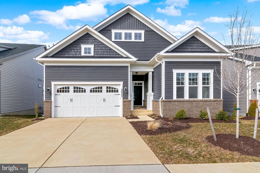 +*Highest and best due Sunday 3/2 at 6pm**Why wait for new construction when you can move into this never-lived-in home today? Located in the highly sought-after 55+ Riverview at Two Rivers, this stunning residence offers luxury & comfort. Step inside to 10 ft ceilings and an open-concept design that fills the space with natural light. The chef’s kitchen is a dream, featuring KitchenAid stainless steel appliances, granite countertops, and elegant finishes. The spacious living room with a gas fireplace seamlessly flows into the screened porch with a peaceful pond view, creating the perfect indoor-outdoor living experience. The main level boasts three generously sized bedrooms, including a large primary suite with two walk-in closets, an ensuite bath with a double vanity and a walk-in shower, plus serene pond views. Two additional bedrooms are filled with natural light and share a stylish full hall bath. The lower level is mostly finished and offers a walkout to the backyard, a full bath, and endless potential to customize the remaining space. A laundry room connects to the 2-car garage for added convenience. Enjoy resort-style living with endless amenities, including a clubhouse, indoor and outdoor pools, trails, a community garden, a private dog park, a lake, pickleball and tennis courts, a state-of-the-art fitness center, a yoga studio, a cyber café, a ballroom, and more. Conveniently located with easy access to DC, Annapolis, and the Eastern Shore.