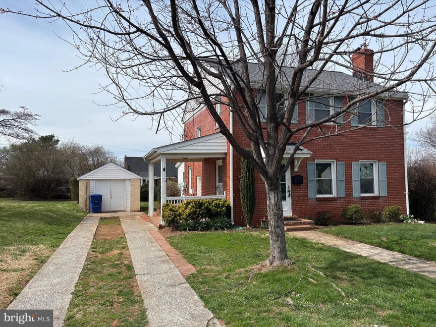 Beautiful brick Colonial with Lovely partially fence backyard and front yard. Closed in finished back porch/sunroom off the back of the house used as Family room with built in book cases and plenty of windows for natural lighting overlooking back yard.  This home has so much character and original charm. It's just the perfect home!  Original hardwood flooring, fireplace, and lovely living room with arched doorway.  This room  is great for family entertaining.  Home also offers plenty of storage room in the basement and attic.  These spaces can also be finished for additional rooms. Close to town shopping, public pool, parks and restaurants.  Detached garage that can be used as shed or one car garage.  Backyard offers garden spaces and private outdoor living spaces.  Covered side patio is great for entertaining.