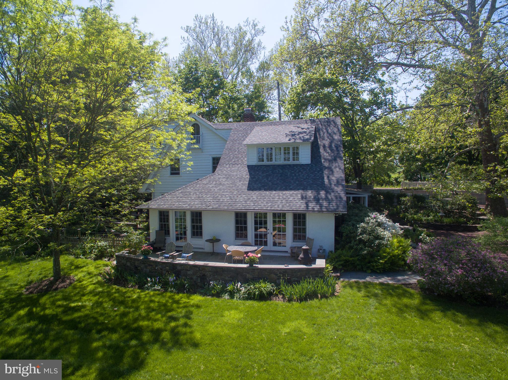 LongShadow is one of those rare gems hidden away on a private stretch of riverfront that only New Hope can provide. The half acre plus parcel is linear and therefore, offers the most advantageous river views. This circa 1920's cottage has been expanded over the generations, and, yet, still maintains the charm and aesthetics of the proverbial fishing cottage. The home provides four bedrooms and two and a half baths and an updated eat-in kitchen. The large, vaulted Great Room is filled with natural light from the walls of glass. An adjacent Solarium is ideal for an office, breakfast room or the "Winter Home" for all of your outdoor annuals. The library, with fireplace and built-in book cases, lures those who love to sit in front of the fire and read their favorite novels. Directly adjacent to this library is an inviting patio that was meant for either al fresco dining or the placement of a future hot tub/spa. The grounds meander along the river for, seemingly, endless views and the steps down to the water's edge. The Buyer can add a floating dock to launch their own "S.S. Minow." A scenic stroll down the Towpath will deliver you to everything New Hope has to offer in a few minutes...fine dining, galleries, the Buck's County Playhouse and the regularly scheduled fairs and events. LongShadow is a property whose soul calls to you and invites you to find your way home. Special Note: A new septic system is currently in the process of being installed.
