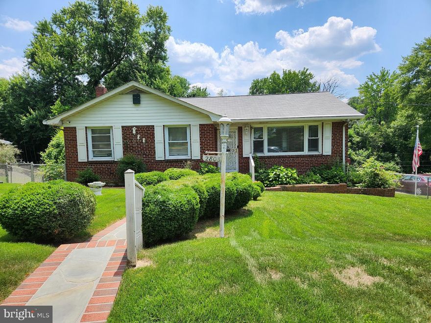 All brick single-family home in quiet, metro convenient community, just minutes from Washington, D.C. Gleaming hardwood floors throughout the main level, which features a spacious living room, updated kitchen and baths, separate dining room and three generously sized bedrooms. The contemporary kitchen is complete with stainless steel appliances, granite countertops, ceramic tile and updated cabinetry. Counters and cabinets have been extended into the dining room for additional storage and entertainment surface space. The fully finished basement provides additional flexibility and boasts an expansive family room, bonus 4th bedroom, full bath with jetted tub, full laundry and full eat-in kitchen with walkout to rear yard; the perfect in-law suite accommodation. Enjoy endless summer days and peaceful autumn nights on this beautifully landscaped lot, with fully fenced in rear yard, private patio with electronic retractable awning, several garden beds, a storage shed, 3+ car driveway and back up generator for your convenience. Walkable access to local parks and public transit further enhance the accessibility of this location, allowing for stress-free commuting and exploring all that the area has to offer. A short drive to I 495, 295, MGM Grand Casino, National Harbor, Joint Base Anacostia Bolling, Andrews Air Force Base, the Navy Yard, Naylor Road, Branch Avenue, and Suitland Metro Stations. This home is a must see!
