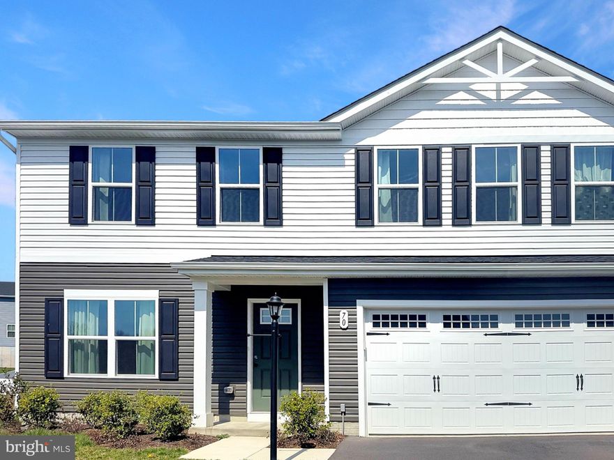 Picture yourself at 70 Stocking Pond Rd, a residence designed for ease of use and practical living. The kitchen is equipped with all stainless steel appliances and includes a functional island. The primary bathroom contains double sinks for enhanced utility. This home blends modern features with daily convenience.. Included 100-Day Home Warranty with buyer activation