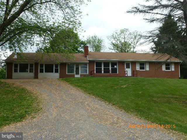 Large Rancher on private unrestricted lot. Large main level family room connected to house by enclosed breezeway. Mostly finished basement with second large family room. Property being sold AS IS.