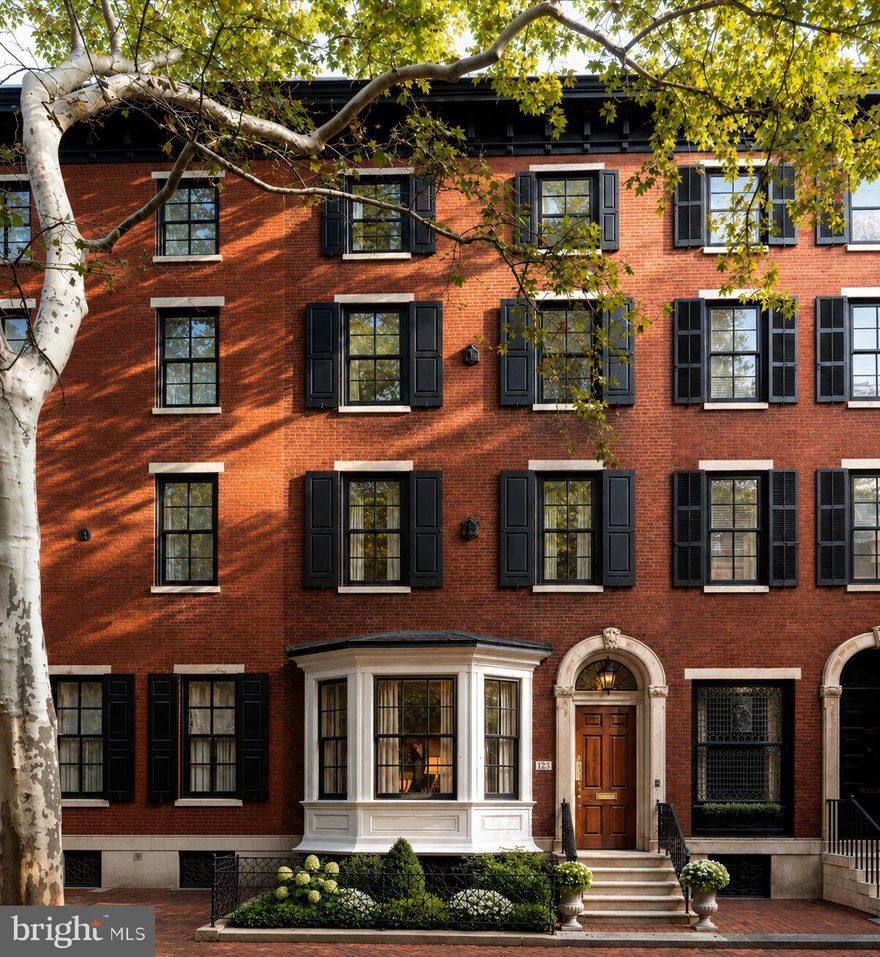 Located on one of the most iconic blocks of Philadelphia, 1823 Delancey Place will be a reimagined architectural stunner designed and built for the most discerning Buyer. Curb appeal is exemplified on this block and 1823 Delancey is one of the few homes with a front garden. As you make your way up the stone stairway, you will be welcomed by a gorgeous foyer leading into a large open living / dining concept  which features huge ceiling height, chevron laid hardwood and a custom bar perfect for nights of entertainment. The rear of the home includes an incredible kitchen and breakfast area fully equipped with custom cabinetry, state of the art appliances and a gorgeous stone countertop flowing up the backsplash. The kitchen also overlooks a newly designed outdoor deck, perfect for grilling or enjoying your morning cup of coffee. The lower level of the home incudes a fully finished basement and access to the true two car SIDE BY SIDE garage. The elevator is conveniently located off the garage and will service all interior floors. Floor two of the home is where your primary bedroom suite overlooking Delancey Place is located. Huge ceiling heights amplify this room which also features an equipped walk in closet and beautiful primary bathroom. The rear of floor two is a huge media room - perfect for informal entertainment. The additional floors include 4-5 additional bedrooms, 3 bathrooms huge laundry room. The crowning feature is the roof deck overlooking Philadelphia. The home provides a blend of modern convenience and historic charm. Design by LT Design and brought to life by an experienced local builder, this home is undergoing a full home renovation down to the studs. Delivery is Spring 2027 - early Buyers will have an option of choosing design finishes. 10 Year tax abatement will be applied for by Builder.