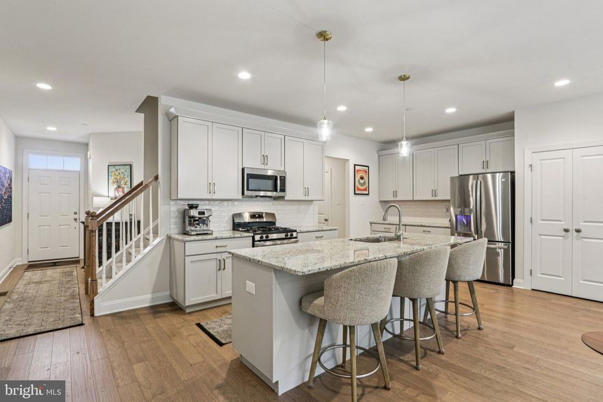 Incredible value for a home built in 2024! Brand new, barely lived in with $25,000 in custom and stylish upgrades! Come discover Sutton Grand at Willistown Point - this modern 3-bedroom, 2.5-bath newly constructed townhome offers just over 2000sq ft of beautifully designed living space in one West Chester's most sought after communities. Enjoy an open-concept layout perfect for entertaining and everyday living. The chef's kitchen with granite countertops, stainless steel appliances, sleek modern cabinetry and large island is the center piece of this sun-lit space! The warm, sun filled great room with luxury vinyl plank floors offers easy access to the back patio where you can soak in the sun and enjoy a beautiful wooded view.  Upstairs it's all about the details with Heringbone tile floors in the main bath and laundry room. Enjoy a spacious primary suite with walk-in-closet, custom vanity and walk-in shower. Two additional bedrooms offer ample closet space and designer finishes throughout.  This thoughtful home offers low-maintenance living in a walkable, scenic community. Nestled in the prestigious Willistown Township, minutes from downtown West Chester, major routes, and award winning schools!