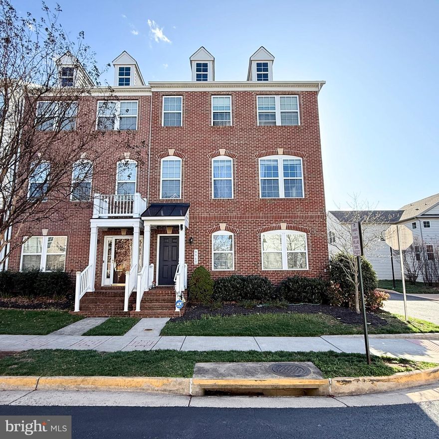 Welcome Home! This stunning end-unit townhouse, a former Kendra model home, is packed with premium upgrades in the highly sought-after Hastings Marketplace community—just 1.5 miles from Old Town Manassas! With easy access to Prince William Parkway and the Manassas Amtrak/VRE Train Station, this home is a commuter’s dream.

Move-in ready with modern enhancements throughout, this home features a Smartcom security system, built-in speaker system on all three levels, updated flooring in the basement and lower level, custom window treatments, and abundant recessed lighting—even in the garage!

The gourmet kitchen boasts quartz countertops, under-cabinet lighting, a stylish backsplash, upgraded light fixtures, a center island with seating, a message center, and stainless steel appliances. The main level showcases an open floor plan, elegant dark hardwood floors, and a striking three-sided gas fireplace between the living and dining areas.

Upstairs, the luxurious primary suite features a tray ceiling, walk-in closet, and an upgraded en-suite bath. Both upper-level bathrooms include quartz countertops, double sinks, upgraded lighting, and privacy toilets. Two spacious secondary bedrooms complete the upper level.

Convenience is key, with shopping and dining just steps away! Minutes away to Hastings Marketplace Shopping Center,  Harris Teeter and more. Don't miss out on this exceptional home—schedule your showing today!