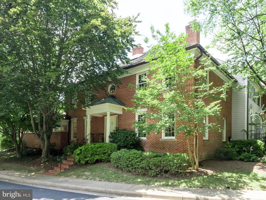 FABULOUS LOCATION  Langley School District! Quiet Neighborhood Street-No Thru Traffic-Brick Front TH w/3 Levels! 2 Car Garage!  Hardwoods! Large Kitchen Breakfast and Dining Room Both Open to Lovely Private Brick Courtyard for Perfect Entertaining! LG Rec Room.