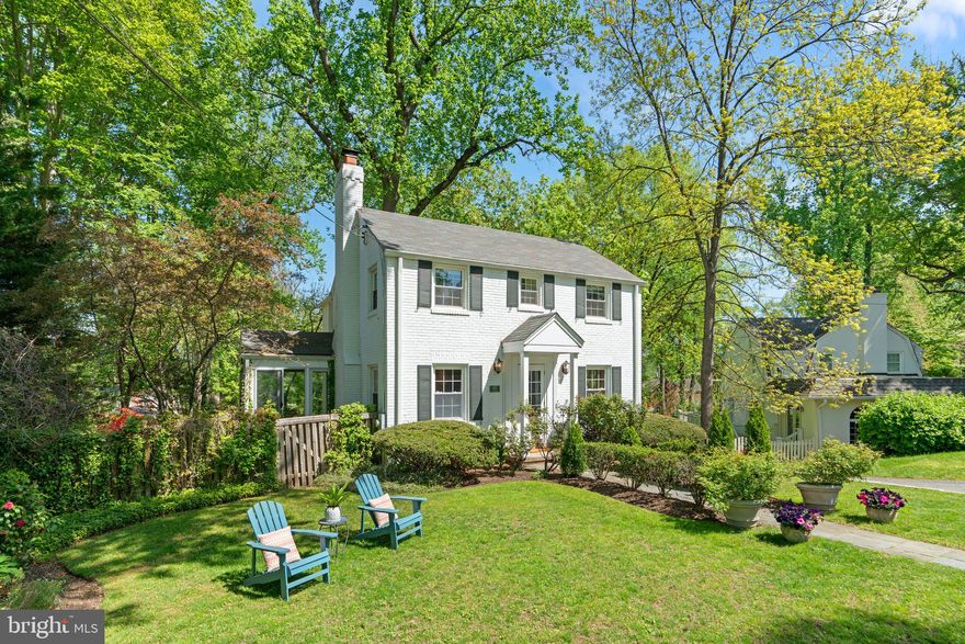 NEW PRICE! WOOD ACRES — Bethesda’s most charming neighborhood is tucked beneath a canopy of mature trees just off Massachusetts Avenue, offering easy access to downtown Bethesda, D.C. and the 495. Known for its strong sense of community, Wood Acres features an active citizens association, neighborhood events, and beloved seasonal traditions. Wood Acres Park anchors the neighborhood, serving as a community hub with tennis courts, a playground, and sports fields. Wood Acres Elementary School is another cornerstone of the community and is walkable for children. The Capital Crescent Trail, Glen Echo Park, and the Potomac River are moments away.
6105 WELBORN DRIVE is a classic brick Colonial perfectly nestled on a spacious, maturely landscaped and hardscaped lot, offering incredible views both inside and out. The sun-filled main level features an open floor plan with a kitchen-dining room combination, a living room with the original mantle and wood-burning fireplace, a family room opening to a side deck, a glass sunroom suspended in nature, and hardwood floors throughout. The upper level offers three generous bedrooms. The primary bedroom includes an ensuite bathroom and two custom closets, while the original hallway bathroom is shared. Hardwood floors continue throughout this level. The lower level offers a spacious recreation room, a fourth bedroom with a private rear entrance, a half-bath, and a laundry/utility room. Many original details remain throughout the home. The lovely rear terrace, terracing, and pathways are designed for outdoor recreation, family gatherings shaded by trees and perfect for backyard evenings around the BBQ and fire.
