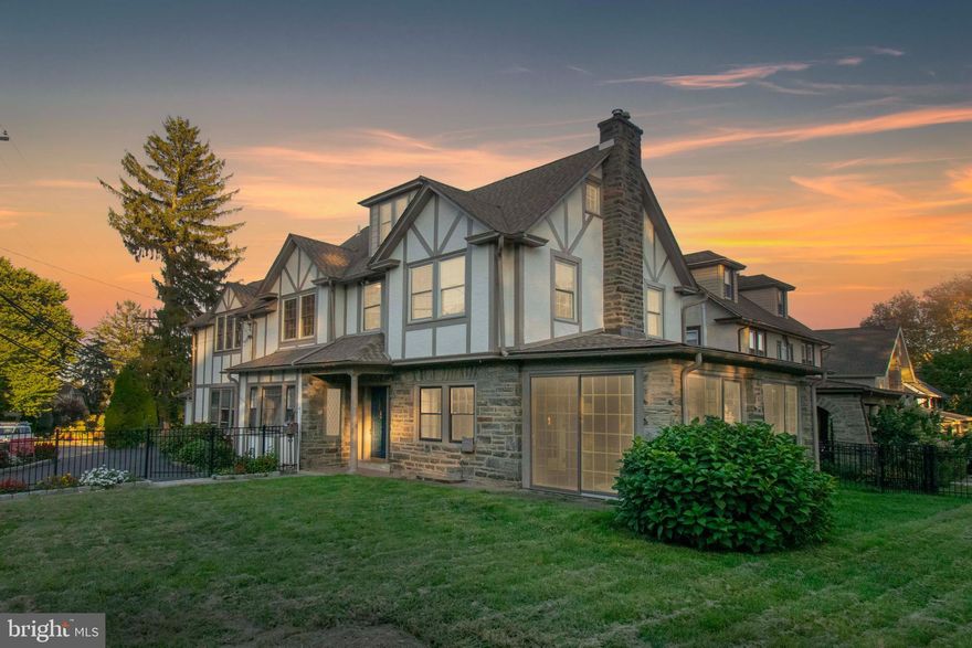 Nestled in one of Havertown’s most desirable neighborhoods, 501 E. Manoa Road is a distinguished 1920s Tudor that seamlessly marries timeless architectural detail with thoughtful modern updates. This stately residence offers over 3,200 square feet of refined living space, set amidst beautifully landscaped, fenced grounds that ensure privacy and tranquility.
Step inside to discover a gourmet chef’s kitchen appointed with top-tier Viking appliances, granite countertops, and an inviting breakfast nook—perfect for morning gatherings. The formal dining room and elegant living room with a wood-burning fireplace and original period moldings exude warmth and sophistication, ideal for both entertaining and everyday living. A heated sunroom, drenched in natural light, offers year-round enjoyment and quiet relaxation.
Upstairs, the primary suite is a true retreat, featuring a spacious sitting area, a beautifully appointed en-suite bath, and a generous walk-in closet with integrated laundry. Four additional bedrooms, two full baths, and a powder room offer ample accommodations for family and guests alike.
The finished lower level includes a recreation room with custom built-ins—perfect as a playroom, media space, or home gym. Outside, mature landscaping and buffer plantings surround the property, providing a private oasis just moments from the vibrant Brookline Boulevard corridor.
This is a rare opportunity to own a legacy home that offers the character of the past with the comforts of today—all within walking distance to local dining, shopping, and the high-speed line. Welcome home.