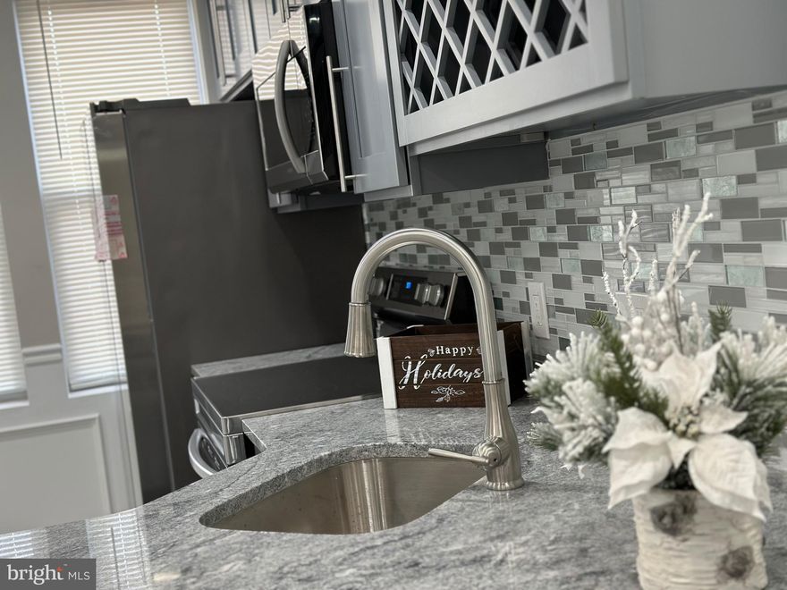 Back on a market!! Let this desirable house on beautiful street be your new home! This elegantly designed and well appointed home offers stunning interior accents, spacious bedrooms, three full spa bathrooms, finished walk out lower level, and a brand new kitchen with upscale cabinetry, stainless steel appliances, breakfast bar, granite countertops, designer tile work and backsplash, and open access to the lower level family room for you to relax and entertain. Don't miss the custom colors and recessed lighting. The first floor offers  beautiful layout with decorative fireplace. Deck off of the kitchen for you to relax and entertain. The upstairs boasts three spacious bedrooms with two full spa bathrooms. Master suite has its own spa bathroom. This home offers plenty of closet space and sunlight! Finished basement with full bathroom and extra room could be used as a 4th bedroom, or a guest suite, also office and your family entertainment space, for more storage. Other features: a central air HVAC system, a brand new water heater, off street parking at rear. Truly a home you don't want to miss out on! Convenient location close to center city and all major roads and transportation. Disclosure: Listing agent is related to the seller and has financial interest.