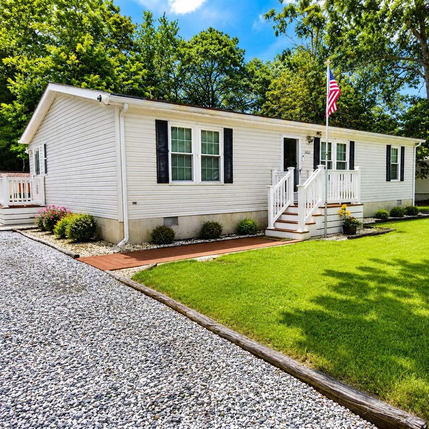 Move-in ready and ideally located near Georgetown, Millsboro, Milton, Lewes, and Rehoboth Beach, this well-maintained home offers affordable Coastal Delaware living with no ground rent and low HOA fees. Enjoy a spacious landscaped yard, enclosed rear porch, Trex side deck, storage shed, and plenty of driveway parking. Roof replaced in 2017, gravity-fed septic system, and water included in HOA fee for added value. Perfect as a primary residence, vacation getaway, or investment property, with most furnishings negotiable for a turnkey opportunity.