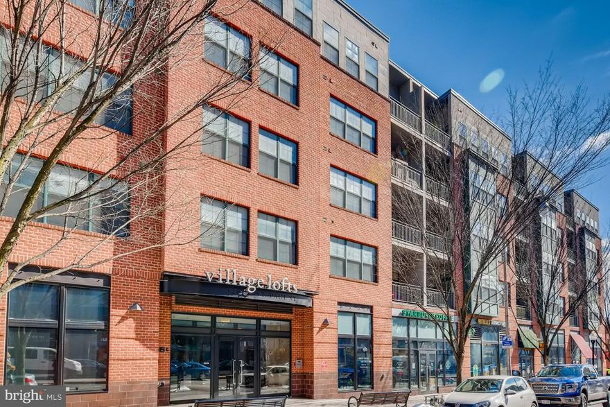 Welcome home to this wonderful corner unit in the highly sought after Village Lofts building of Charles Village!  This property is currently rented to JHU students, leased through May 31st! This home features a wonderful kitchen w/tons of storage, stainless steel appliances, granite counter tops & an island w/bar stool space! This contemporary unit features an open floor plan with a combination living/dining room with tons of natural light shining through & hardwood floors! The primary bedroom is very large w/its own en-suite full bathroom, double vanity, & large walk in closet w/built in shelving. Second bedroom has its own en-suite full bathroom as well as two large closets. Enjoy the beautiful Charles Village neighborhood from your own private balcony! New heating/cooling unit in 2019. One car garage parking space in underground garage and storage unit conveys with this unit!  Located in Close vicinity to Johns Hopkins University, local hospital & local restaurants/bars.