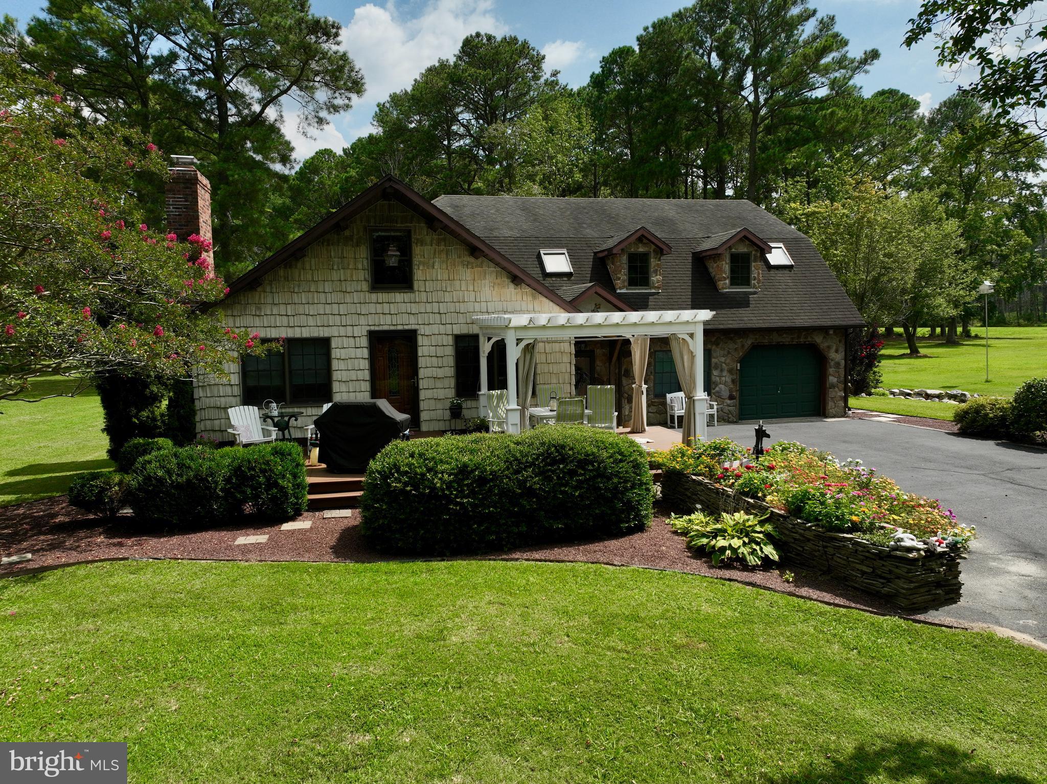 Welcome to your oasis of endless possibilities...all in your own backyard! A truly custom 3 bed/3 bath craftsman home with more amenities than can be mentioned awaits you as you enter the property from your private lane outside the Crisfield city limits. First and second floor primary bedrooms both have attached full baths, and all major kitchen appliances are less than 3 years old. Please note that permitted additions were done and the square footage is closer to 2400-2500 rather than what is denoted in the SDAT.
Tired after a long day at work, or a long day on the boat after touring the Tangier Sound? Relax on your back deck overlooking your nearly 14 acres of land, or host gatherings in your screened-in gazebo. Planning summer barbeques? The wet bar, firepit and ample seating area are an entertainer's delight! After a long day mowing or just doing general farm maintenance, take a breather in your private spa with a hot tub and sauna! Looking for fun or adventure instead of relaxation? Have fun in the elevated Dr. Seuss themed playhouse and come back down to ground level via your private zip line!
The huge, fully insulated pole building, approximately 64'x100', is truly multi-purpose and would be perfect for horses or livestock with a few modifications. Solar energy supplies the entire property, including the pole building and the panels have been paid for in full! A waste supplied heating system provides temperature control, even in the winter.
Property lines run along the back of Sackertown Road, with Crisfield city water and a private septic, as well as a secondary ingress/egress route...but with no city taxes!
If any or all of this seems like it’s the life you’re looking for and the home you've been searching for, you better come check it out quickly before it’s scooped up by someone else! Private Oasis. Paradise. Working farm. Entertainer’s delight. An escape from the world? Have a bit of it all!