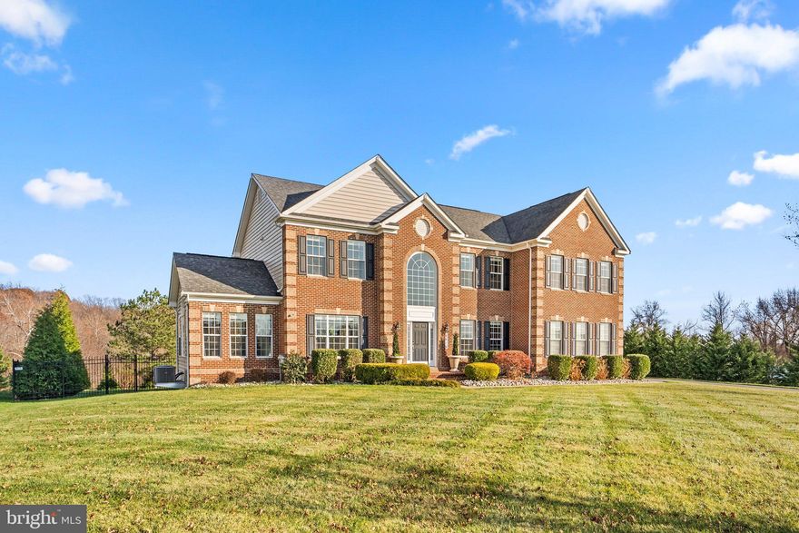 Welcome to a residence that epitomizes luxury and space! This exquisite 4-bedroom, 4.5-bathroom single-family home is gracefully situated on over an acre and a half of land in the esteemed Windsong community in Prince George County. Spanning an impressive 6,224 square feet, this meticulously designed residence offers a harmonious blend of opulence and functionality.

The thoughtful layout of this home provides not only generous living space but also a sense of tranquility within the private and fenced-in oasis that encompasses the outdoor surroundings. Entertaining becomes a seamless experience in the expansive living areas, soaring ceilings where the transition from indoors to outdoors enhances the overall entertainment atmosphere.

Every corner of this residence reflects attention to detail, with thoughtful renovations and an unmistakable touch of care. The kitchen, a focal point of the home, showcases quartz countertops with a prep sink, updated island lighting, and top-of-the-line appliances including 4 chef cooking stations with an 8-burner gas range plus two stacked ovens and a fume hood exhaust.

The flooring throughout the home tells a tale of warmth and sophistication, with brand new warm-toned flooring on the main level and cool-toned flooring in the basement. Molding details grace both the main and basement levels, adding a touch of elegance.

The lower level is a testament to both luxury and entertainment, featuring a finished basement with a full-size bar equipped with a fridge and freezer. A newly constructed billiard section and lounge area offer a perfect retreat for relaxation and socializing.

The outdoor space is a haven of privacy, enclosed by a complete backyard fence and enhanced by a backyard privacy green screen of Thuja green giants. Additional features include a wine cellar closet and an enclosed glass gym, creating a space for both indulgence and wellness.

This residence is not just a home; it's a masterpiece that invites you to experience the pinnacle of comfort, style, and modern living. Every detail reflects the dedication and love invested in creating a truly exceptional living environment.