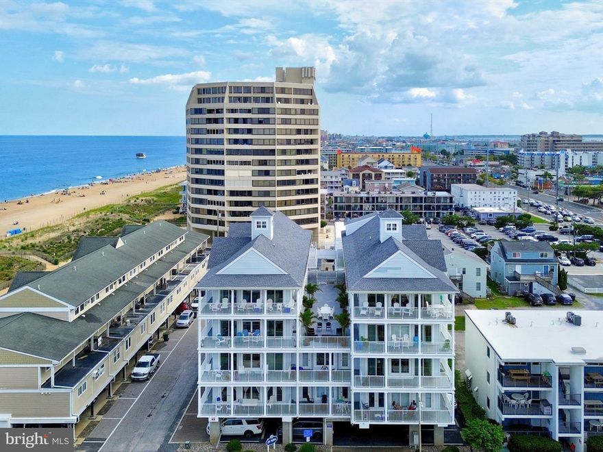 This spacious unit, just steps to the beach, has 5 bedrooms and 4.5 baths, new HVAC unit, newly replaced sliding doors, and surround sound featured in the open living areas as well as wrap around balconies with views of the beach, Atlantic Ocean & Assawoman Bay. The condo has 3 covered assigned spaces, for no hassle parking and a building elevator for ease of trips to and from the beach. "Sunrise" Unit 303, has been an occasional summer retreat for the current owners and is approximately 2622 sq. ft. and will convey with most furniture. The Gourmet kitchen features granite counters, plenteous kitchen cabinets , built in wine cooler & icemaker, the granite island conveniently offers a cooktop & vented stainless steel range hood so you can prepare a feast while socializing with your guests. The living area has aesthetically pleasing cork flooring, sliding doors and windows galore allowing an abundant of natural sunlight with views of the ocean and bay. This is an incredible offering to allow large families or great travel friends to own together in one of the most desirable garden style condo buildings in town or an incredible investment opportunity that could bring in over $100k+- in gross rental income per year.