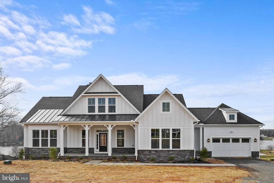 Lake Anna, voted #1 location to own a beach house by Vacasa in 2023.  Rather you are looking to have a short term rental, own a family vacation home, or live year round at beautiful Lake Anna, this home is the perfect property.  Escape to your own private waterfront oasis. This brand new luxurious 6 bedroom, 7.5 bathroom property, with 6,500 square feet of living space and boasting 343 feet of water frontage is ready for its new owner to start making memories for a lifetime. Enjoy the stunning water views from 5 of the 6 bedrooms, including the grand primary suite with a spa-like en-suite bathroom and private office. Entertain in style in the gourmet kitchen with high-end appliances, pot filler, upgraded cabinets, luxury countertops and more.  Kitchen flows seamlessly into the dining area and the open-concept living room with stone, quick start wood-burning fireplace and coffered ceilings… perfect for entertaining!  Second owner's suite on the main level and three additional bedrooms with attached baths on the upper floor, create a perfect space for hosting guests.  Huge basement with an additional bedroom, two full baths and multiple recreation spaces complete the home.  
Stunning custom features throughout the home include LVP flooring, lots of lighting, stackable sliding doors to the deck, and so much more.
Brand new patio just added.
Take a dip in the lake or relax on the expansive screened in deck while taking in the picturesque surroundings. This property offers the ultimate in waterfront living with its prime location, top-of-the-line finishes, and endless amenities. Don't miss your chance to own this one-of-a-kind piece of paradise.
New boat dock with two boat slips just completed.