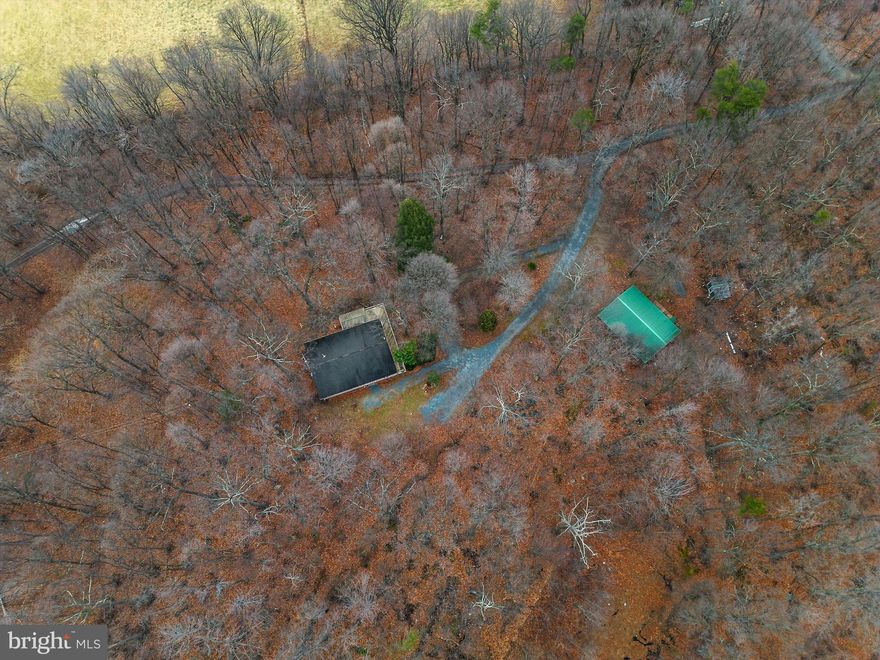 Calling all handy homeowners and nature enthusiasts! This property boasts seclusion, stunning natural surroundings, and a world of possibilities.  PRIVATE!!  VIEWS!!  stocked  POND!!   18+ WOODED acres.  30x40 Detached Workshop/Shed with electric.  Full walkout basement with a Full Bath,  and plenty of space to finish as you wish.   A  little "elbow grease" and a few more updates will make this property shine. Property is  In Land Use:.  Internet unknown--Buyer will need to do their own research