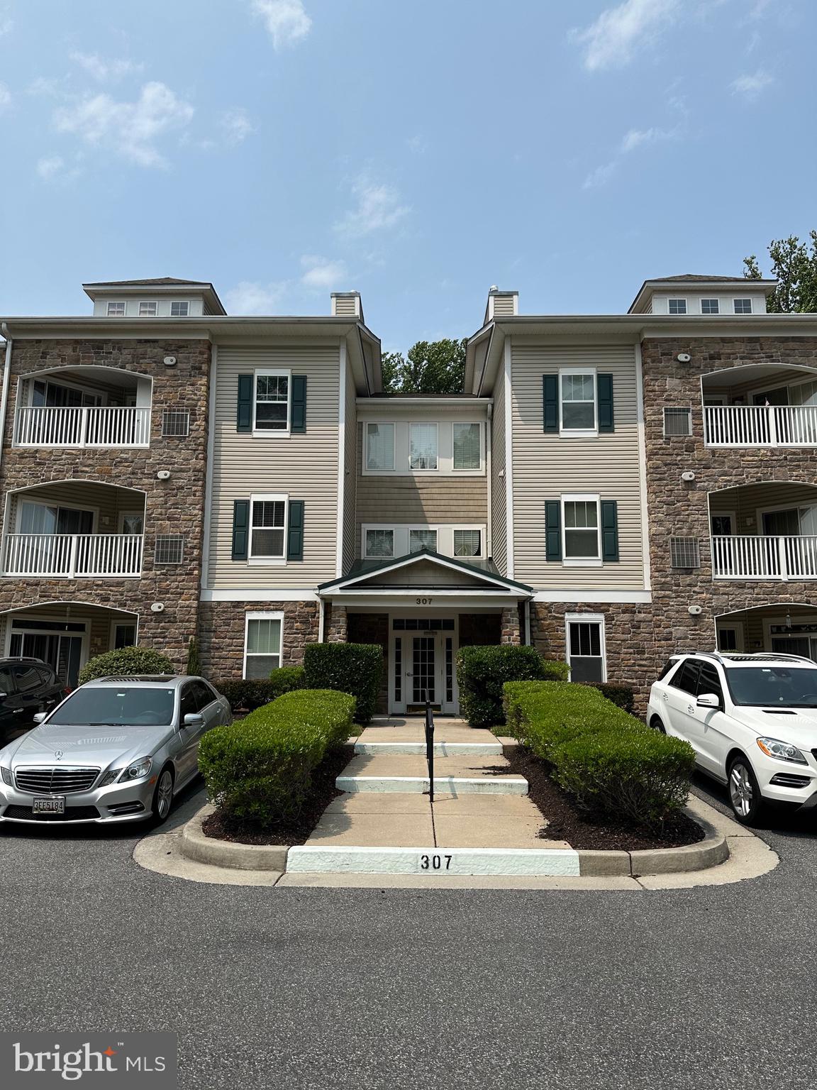 This spacious one level condo in a 55+ community is move in ready and available for you to see today. Enjoy the open floor plan where everything flows seamlessly. Bedrooms are on opposite sides to allow for privacy when you have guests or family stay the night. Soak in the tub, or simply enjoy the spacious bathroom. Closet is a walk in an allows you to have an endless wardrobe. Unit is easily accessible by means of an elevator. Beautiful wood floors in the living room. Enjoy this space and get cozy by the fireplace. On a nice day, enjoy some time out on the balcony. Washer and dryer in unit. Easy and fun living with everything you need in the building. Head downstairs and be a part of the community in the common areas. There is even a common area kitchen if you'd like to throw parties and have snacks and beverages to place somewhere. Make friends and head over to the pool or ping pong table for friendly competitions. Stay active and head over to the fitness studio. All of these things are in the same building, just an elevator ride away! Feel safe with the sprinkler system inside the unit. When you want to come out of the building, enjoy the walkways filled with trees, greenery, and fresh air. Benches are conveniently located along the walkways. Head over to the gazebo style area and have lunch outside or head over to the community greenhouse and start your next project. Whatever it may be that your heart desires, you will find it here, at 307 Wyndham. Come by, check it out, fall in love.