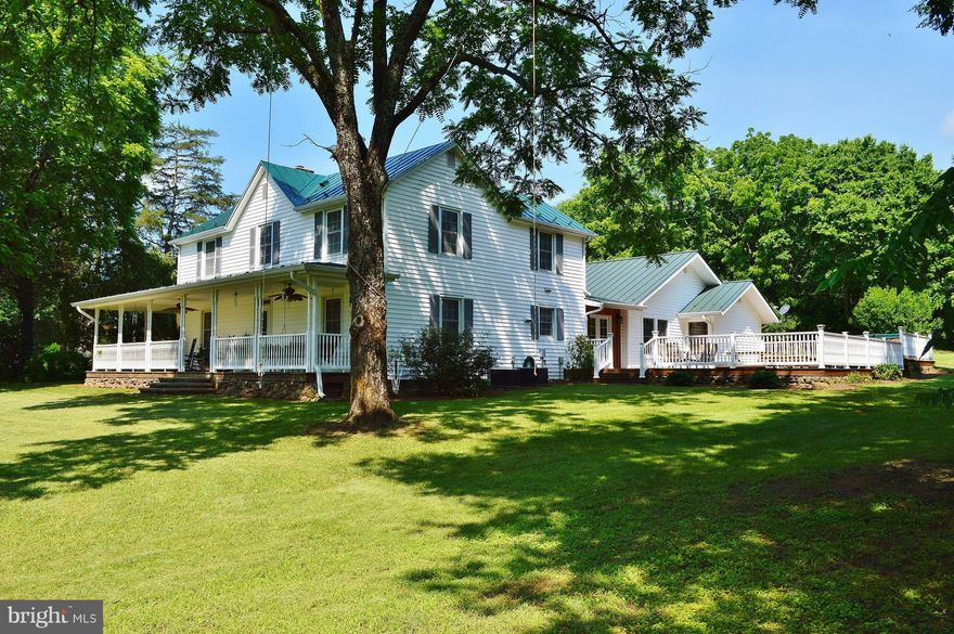 Sit back, relax & enjoy the view! Extensive hardscaped patio, huge deck w/ Jacuzzi. Enjoy your mornings watching the birds on the covered porches. If you're looking for the perfect country setting, this home will not disappoint! lots of updates throughout including, tile flooring, updated bathroom & entire addition including 2BR, living room, full bath set up is to be handicap accessible