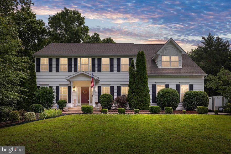 This stunning 5-bedroom, 3.5-bathroom Colonial home is located on over 1 acre at the end of a quiet cul-de-sac in the desirable North Clearview Heights neighborhood. This home offers a perfect blend of space, comfort, and convenience, making it ideal for family living. The heart of the home is the spacious gourmet kitchen, which features gorgeous cabinets, granite countertops, stainless steel appliances, a large island, and a pantry. It seamlessly flows into the family room, complete with a cozy gas fireplace and a tray ceiling, creating an inviting space for gatherings. The adjacent breakfast room, with crown molding and tile flooring, is perfect for enjoying meals and morning coffee. Thoughtful details throughout the home include chair rail and crown molding in the living and dining areas, luxury vinyl plank flooring in the living room, dining room, and lower-level recreation room, and a convenient main-level laundry room. The primary suite is a true retreat, featuring a walk-in closet, a sitting area, and vaulted ceiling. The primary suite bathroom offers his and her sinks, a separate shower, and a soaking tub, all with beautiful tile. There are four additional bedrooms, each with ceiling fans and carpet, and two full bathrooms, providing ample space for family or guests. The fully finished basement provides additional living space with a recreation room, wet bar, breakfast area, and a full bath. This area could easily serve as an au pair suite or in-law suite, offering privacy and comfort with its own kitchenette and full bath. Step outside to enjoy the amazing outdoor space with a deck and a screened-in deck, perfect for relaxing or entertaining while enjoying the tranquility of the backyard. This home also features a brand-new roof, installed in December 2024, providing peace of mind for years to come. Located just minutes from the VRE, I-95, downtown Fredericksburg, the YMCA, and parks, this home offers easy access to all the amenities and conveniences you need. With its spacious interior, luxurious finishes, and prime location, this home is truly a must-see. Schedule a tour today and make this dream home yours.
