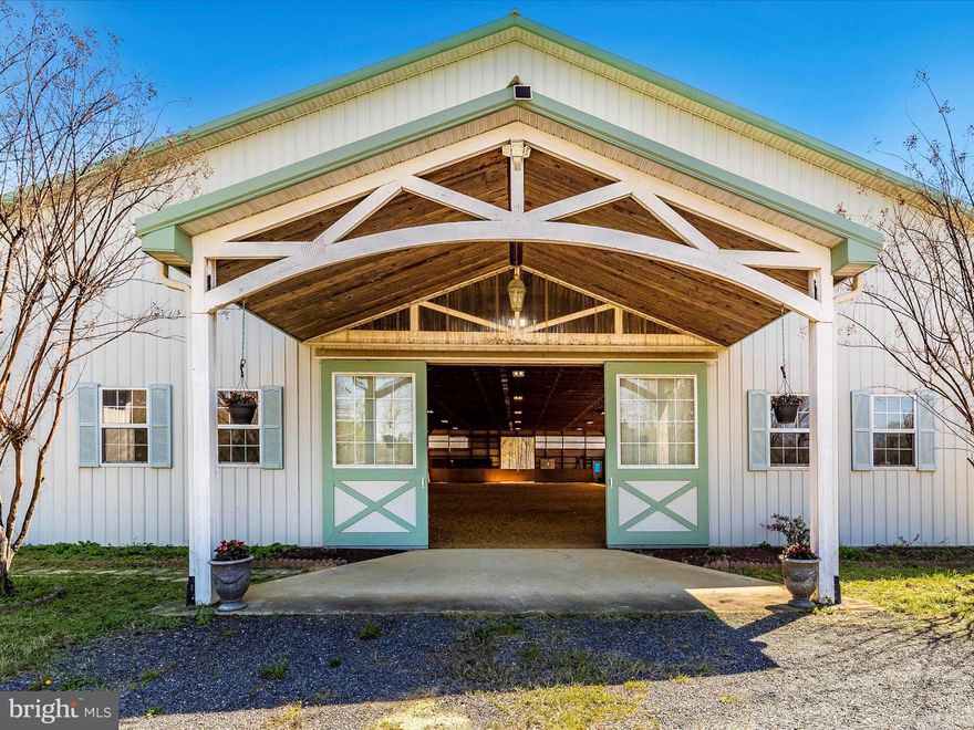Turn-key 21-acre horse farm just 20 miles from the District! This farm has so much to offer for both professional equestrians and hobbyists alike. The center aisle barn features 15 stalls, 2 tack rooms, a feed room, ample storage for equipment as well as a heated office, bathroom, and lounge. Attached to the barn is a 20m x 40m indoor arena with mirrors, new LED lighting, and TruTex footing. Outside, you’ll find a 27m x 68m outdoor arena, 11 pastures, and a secondary barn with 3 stalls and even more equipment storage. When it comes to boarding and training, the current owners have been full with a waitlist for sometime and receive calls nearly every day from prospective boarders. The proximity to Alexandria and D.C. make the location unbeatable for those looking to run a business or commute though working from home would not be a problem as the property now has Verizon broadband internet. The 4 bed, 3.5 bath ranch style farmhouse features exposed beams, new tile, new carpet, refinished hardwood floors. Additional updates include HVAC, replacement windows, master bath remodel, guest bath remodel, insulation, a brand new roof, and more! Not only that, but this 21-acre property is comprised of two lots. The 2.35 acre lot provides an incredible opportunity to build your dream home and rent the existing home to a tenant or trainer.