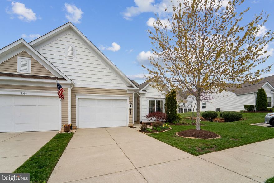 ***Open Houses Canceled*** Welcome to 142 Hyannis Place; an exquisitely updated end-unit townhome with 2 bedrooms, 2 bathrooms and a versatile flex room—ideal for a home office, den, or exercise space. The home is nestled in the Celebrate Virginia North; one of Virginia’s premier active adult 55+ communities! This beautiful home has over $45K in custom upgrades and is designed for both comfort and style. INSIDE: Step inside to discover gleaming hardwood floors throughout the living, dining and kitchen spaces. Custom plantation shutters (2021) and a custom Hearth & Home custom fireplace (2021) showcase the bright and airy open floorplan where you can relax or entertain in your new home. The kitchen has been upgraded with gorgeous quartz countertops, large sink and a custom tile backsplash (both 2021). Culinary enthusiasts will appreciate the updated stainless steel appliances, to include a gas range and french door refrigerator with craft ice maker for your post-activity beverage!
OUTSIDE: Enjoy your own private outdoor retreat complete with TREX deck (extended in 2021), custom privacy screens (2021) and brick addition where you can set up the grill (2022)! The home is equipped with a brand new American Standard furnace (w/ air scrubber and humidifier) and A/C (both installed in 2024) for year-round comfort. COMMUNITY: Residents of Celebrate Virginia North enjoy resort-style amenities, including a 30,800 sq. ft. clubhouse, fitness center, indoor and outdoor pools, and various recreational spaces such as pickleball and bocce courts, a putting green, an outdoor amphitheater, a dining terrace, garden plots, and a community fire pit. Don't miss this opportunity to own a thoroughly and thoughtfully upgraded home in one of Virginia’s finest 55+ communities. Schedule your private tour today for a glimpse into this warm and welcoming neighborhood!