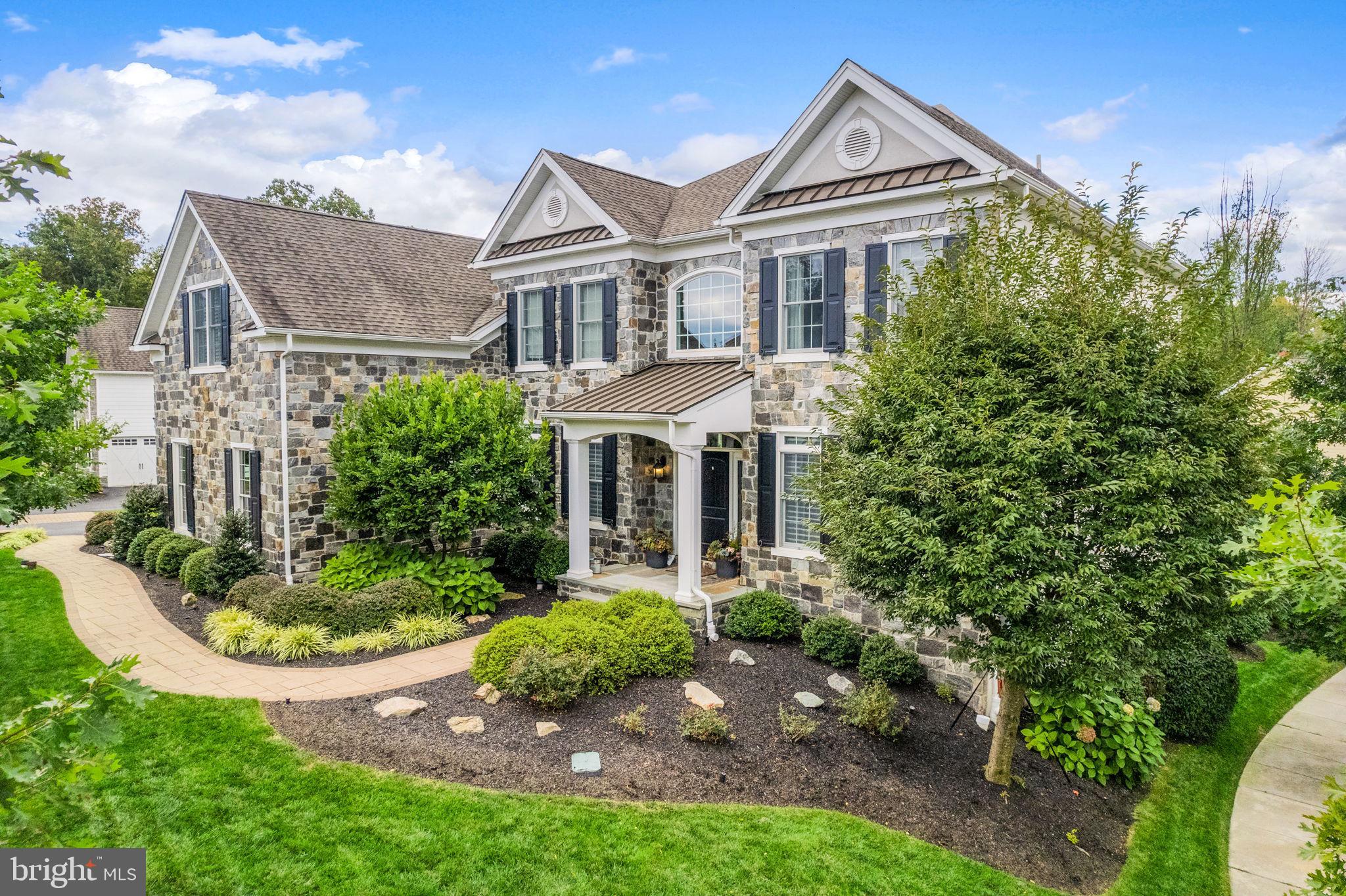 Welcome to this stunning estate situated on a quiet street in the coveted Lister community in the top rated Marple Newtown School District! Enter this home through the three car garage or the stone front porch and immediately notice the gorgeous wide plank, hand scraped hardwood floors and curved staircase in the dramatic two story foyer. No details were spared as you will see in the thoughtful additions of extra wainscoting, wrought iron staircase spindles, crown molding, tray ceilings, recessed lighting, and the home was professionally decorated. To the right of the staircase is the formal living room while the formal dining room is to the left. The family room hosts a wall of magnificent windows, a gas fireplace, and coffered ceiling! An abundance of natural light and open floor plan makes this home perfect for entertaining. The gourmet kitchen boasts luxury appliances such as Subzero refrigerator and wine refrigerator, Wolf gas 6 burner stove, and Wolf double wall ovens, decorative tile backsplash, upgraded counters, and expansive kitchen island. The breakfast area was bumped out for even more space and there are two walk-in pantries. Rounding out the main floor is a large laundry room with built-in cabinets, a spacious office/den, and powder room with wainscoting. Upstairs the primary bedroom provides more wainscoting, a tray ceiling with chandelier, three walk-in custom closets, and primary bathroom with heated floors, separate sinks, grand shower with multiple shower heads, bathtub, and private toilet area. There is a sizable princess suite with a full bathroom that is flawlessly decorated and could make a great guest room. Two more large bedrooms are connected by a jack and jill bathroom. The fifth bedroom features a built-in window seat for enjoying the beautiful views and a built-in desk if you prefer to use this room as a second office. Head downstairs to the finished basement for even more entertaining space in this expansive home. There is a second half bathroom in the finished basement, gym area, tv area, and large storage area. If that's not enough, walk outside to the outdoor oasis where you will enjoy the most magnificent sunsets! The trex deck located right off of the kitchen and breakfast room leads to the stone back patio with fireplace and pergola! Perfectly tree lined for privacy, the back patio is a true show stopper to be enjoyed year round! This home is also equipped with a whole house generator and invisible electric pet fence. The development of Liseter is central to everything – all major roadways for an easy commute to Philadelphia and Wilmington, just a short drive to Paoli Train Station with stops to NYC. Less than a mile to SAP, Ellis Preserve, and the prestigious Episcopal Academy; and minutes to downtown Wayne and Devon with an array of amazing dining and shopping options. Liseter offers a community pool, tennis court, fitness center, and beautiful clubhouse! Come see what it's all about and make this perfectly appointed home yours!
