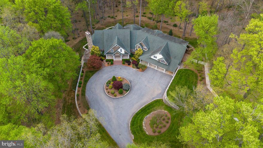 Exceptional Properties. Exceptional Clients.
Welcome to your private sanctuary, where timeless elegance meets luxury and outdoor adventure. Nestled on 31+ secluded acres, this custom-built grand estate offers over 11,000 sq ft. Every detail has been thoughtfully curated with no expense spared—from stunning architectural archways to expansive picture windows that frame breathtaking views of your wooded oasis.  Countless hours can be spent exploring your property which includes a private stream with waterfalls, and access to the Western Run River.
Inside, you’ll find refined elegance at every turn—sprawling open spaces, vaulted ceilings, and premium finishes designed for both entertaining and everyday indulgence. This remarkable home features an elevator, 4 spacious bedrooms( All bedrooms feature en-suite baths), 5 full and 3 half luxurious baths, including the entry level Primary Suite, and multiple flex spaces ideal for additional living quarters, home office, in-law accommodations, or an au pair suite. Radiant heated floors throughout designed for comfort and efficiency. Each room enjoys its own climate zone. Multiple cozy fireplaces add warmth and charm throughout. 
The oversized 6-car garage, circular driveway, and serene setting offer unmatched privacy and convenience. This estate offers complete seclusion—yet it’s just minutes from world-class golf, upscale shopping, fine dining, and vibrant entertainment. Dreaming of hunting and fishing on your own property!? Well you’ve found the perfect place! Brett Manor is more than a home—it's a lifestyle of beauty, comfort, and tranquility. Rights to build a 1000 sq ft Fishing cabin by Western Run(buyer to do due diligence to verify details)***Agents check agent remarks for additional details & docs for Property info sheet*