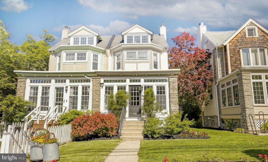 Located in the heart of sought-after Chestnut Hill, this charming three-story, 4-bedroom, 1.5-bath twin offers the perfect blend of character, modern updates, and walkable convenience. Just steps from the shops and restaurants of Germantown Avenue and the Gravers Lane train station, this move-in ready home is truly a must-see.  The welcoming front entrance opens into a bright and airy sunroom featuring convenient built-in cubbies and storage for everyday essentials. Inside, the open-concept first floor flows seamlessly from the comfortable living room to the dining area and into the beautifully renovated kitchen. Designed with both style and function in mind, the kitchen features tasteful finishes, stainless steel appliances, abundant cabinetry and pantry space, generous counter space, a peninsula island, and access to the back deck. A newly added powder room with added built in storage completes the first floor.
Up the turned staircase, the second floor offers three generously sized bedrooms and a full bath. The third floor provides exceptional flexibility with a spacious fourth bedroom and a bonus office, den, or creative space. Additional highlights include hardwood floors throughout, original architectural details, basement exterior access, (see attached upgrade list)  Outside, enjoy the rear deck and low-maintenance rear patio and garden area with access to the rear alley/driveway and attached garage. A turnkey opportunity combining charm, comfort, and convenience in one of Philadelphia’s most desirable neighborhoods.