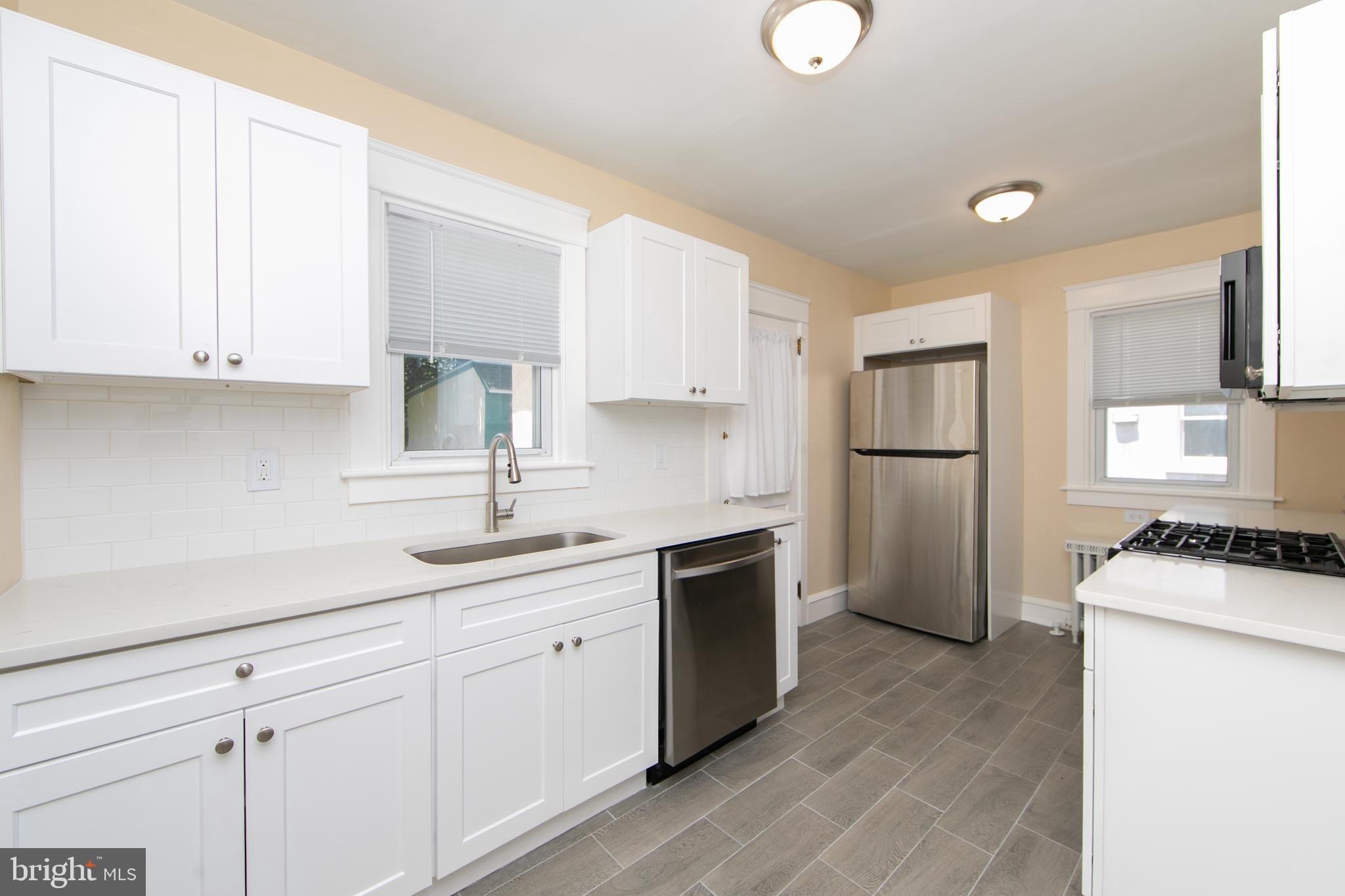 A price improvement makes this MUST SEE home even more affordable. This is NOT a flip, but rather pride of ownership by same family since 1936! Qualified buyers can OWN this home for less than they are paying in rent today. If you're looking for affordability paired with move-in condition, this meticulously maintained home in the heart of Clifton Heights Borough delivers. Featuring an updated kitchen and newer mechanical systems, this charming home is also just a stone’s throw from the brand-new Upper Darby Middle School, currently under construction. From the curb, you'll be impressed by the well-kept exterior. Step up to the enclosed front porch, which offers additional living space during the milder seasons. Inside, the formal living room welcomes you with a decorative (capped) faux fireplace, adding character and charm, and flows seamlessly into a spacious dining room. At the rear, the beautifully updated 2025 kitchen boasts generous cabinet and counter space, gas cooking, and access to both a rear mudroom and the backyard (yard ends at the garage. It does not extend beyond).
Upstairs, the second floor features three traditional bedrooms with hardwood flooring and ample closet space, along with a hall bath that showcases timeless black and white ceramic tile from nearly a century ago. The basement, while unfinished, provides excellent storage potential, laundry facilities, mechanical systems, and walk-out access to the rear yard through a bilco door.
Additional features include a detached garage, a recently sealed and coated flat roof with custom cap fascia and aluminum capping (2024), shingle roof (2020), new main electrical service drop and panel (2025), a high-efficiency Weil McLain boiler (2022), replacement windows, and a gas water heater (2023). The location offers excellent walkability to schools, public transportation, Wawa, places of worship, a variety of local shops and amenities, as well as easy access to Philadelphia, the Airport, and more. This is a rare opportunity to own a move-in-ready home in a convenient location with long-term value. Enjoy the virtual tour before your private tour!