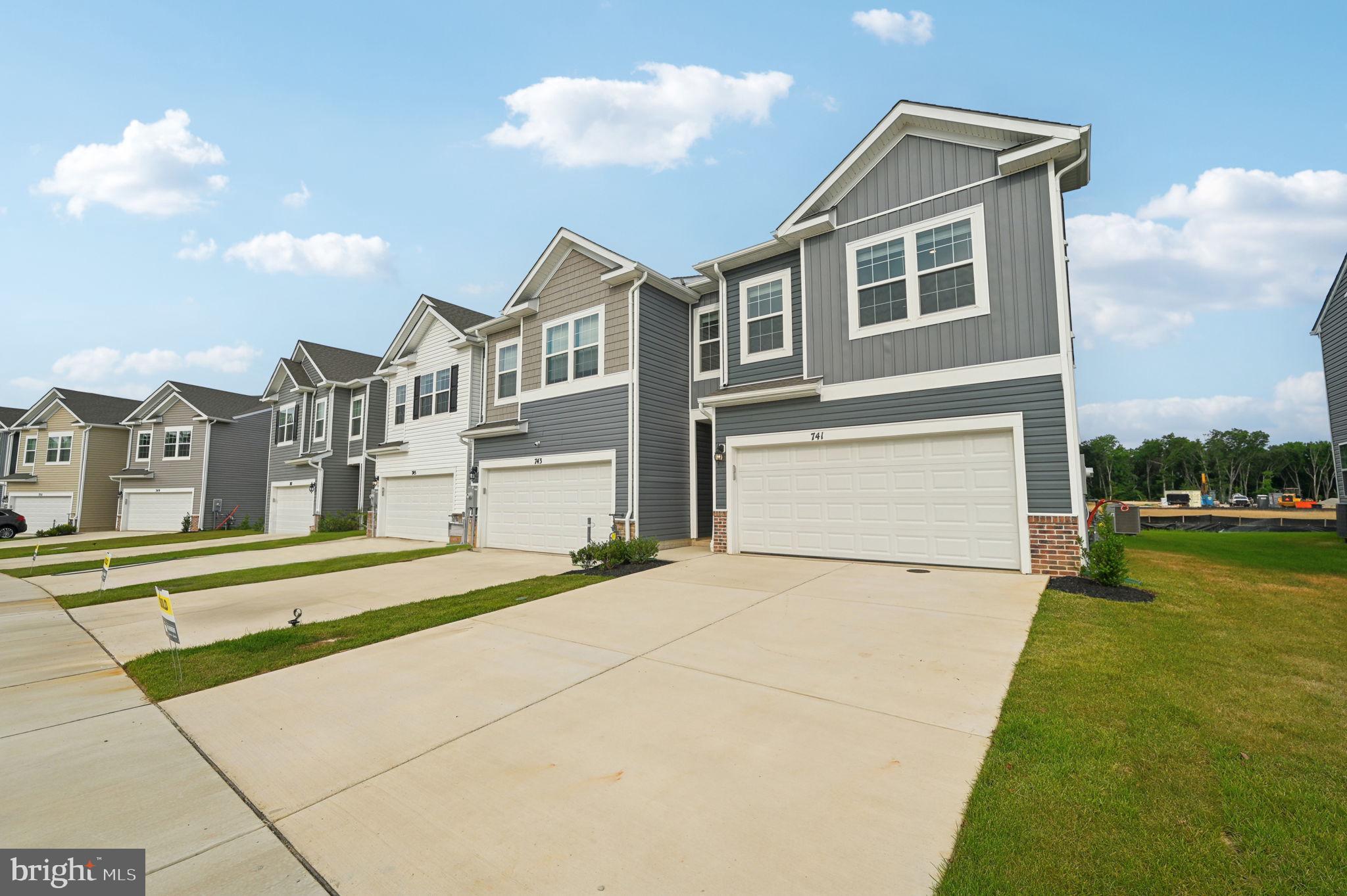 4 Bedroom, 2 car garage “Villa” style townhome! Move in this JUNE!!!
Welcome home to the Andrews two story, four-bedroom townhome floor plan by D.R.Horton. The Andrews is an amazing 24 foot wide attached home that lives like a single family. The home sits at 1934 square feet and has a modern design with a gourmet kitchen and an open floor plan with a sunny great room and dining area! You enter the home from a private walk-up porch to the front door. The home leads to an inviting foyer that flows seamlessly to a sophisticated, modern space. The 2-car garage is adjacent to the kitchen and makes unpacking your groceries a cinch. The kitchen has a 7+foot granite gourmet center island, perfect for food preparation, added seating, and entertaining. In addition to the beautiful cabinets, there is also a large pantry, stainless steel appliances and gas cooking! It’s a chef’s dream. Ascending to the upper level, you’ll appreciate the wide stairway and loft area. On the bedroom level, you’ll find spacious bedrooms with roomy closets, a well-organized linen closet, a thoughtfully upgraded full hall bathroom with a private area for bath and toilet. The upstairs laundry room is an added luxury making life easier and more efficient! The King-Sized primary bedroom is the perfect retreat, complete with a large, double-vanity bathroom and HUGE walk-in closet. The 3 secondary bedrooms are just down the hall and encircle the full hall bath. DR Horton is currently including our popular Smart Home Technology package, all kitchen appliances, blinds in the windows, ceiling fan rough ins, TV prewires, LED lighting and hard surface throughout the entire main level!
The Andrews floor plan is in the Ridgely’s Reserve neighborhood which is Harford County’s most sought after premier single family and “villa style” townhome community. Ridgley’s Reserve sits high over Harford County and provides breathtaking views of the tree lined community. Once inside the spacious, airy, greenery filled neighborhood its immediately evident that the developer put a lot of thought into the details. The Brick monuments and beautiful landscaping upon entry, large lots, playground, widened streets, pocket parks, walking trails, extra parking and more all come together to provide the community members a quiet, comfortable place to call home.
Ridgely’s Reserve is the first exit into Harford County! Conveniently located off I-95 at the Fallston – Joppa exit. This ideal location makes the commute quick and easy to just about anywhere! Including Aberdeen Proving Ground, downtown Bel Air, White Marsh, and north or south of Baltimore. Please come in for a visit!