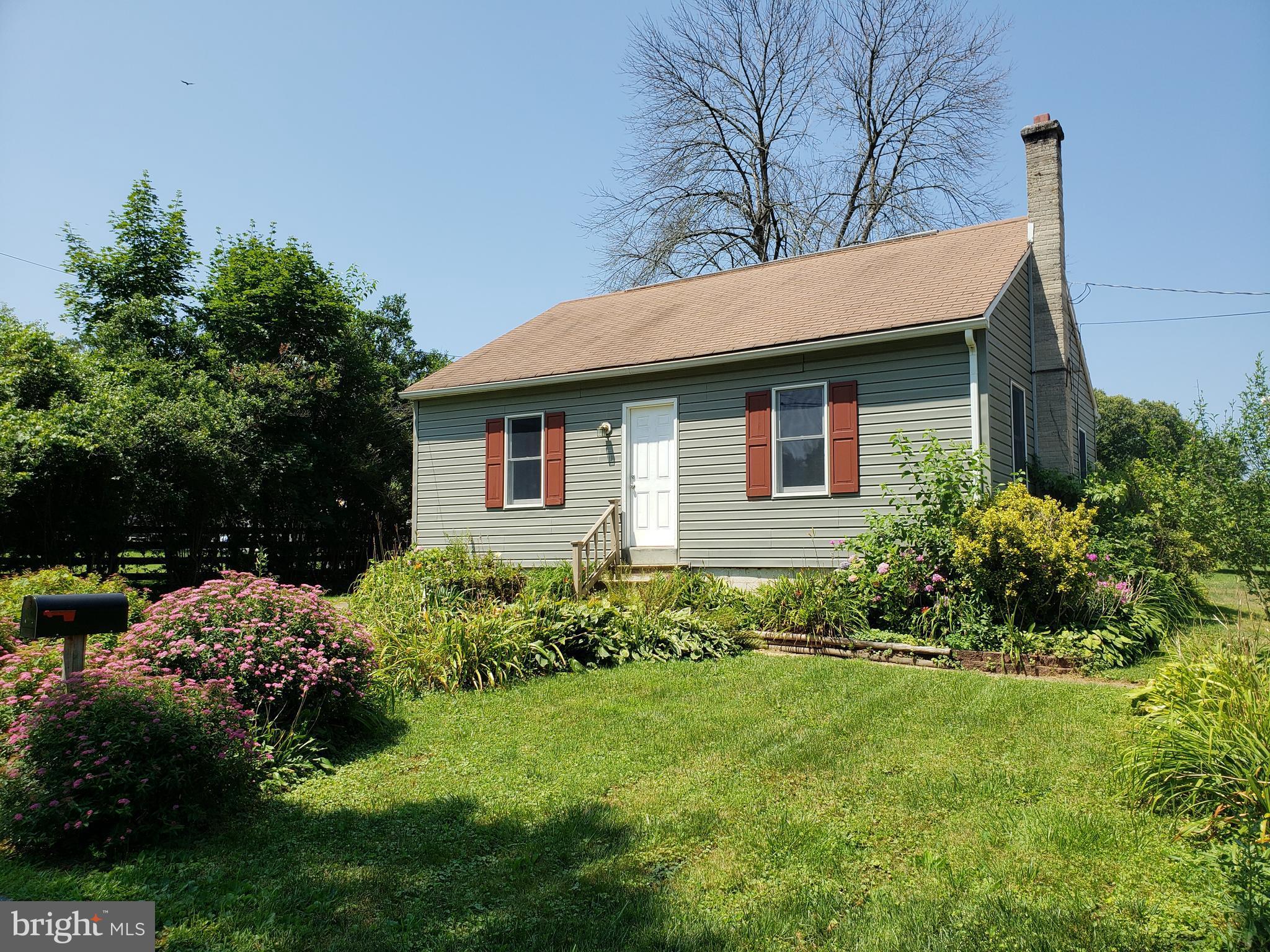 Looking for a convenient location & a bit of land? Here it is! Recently updated kitchen, bath, siding & furnace. Hardwoods through main & upper level. main and upper levels. Landscaped lot that backing to agricultural conservation & minutes to Liberty Reservoir & Owings Mills Town Center. Large basement great for storage. Why rent a town home when you can have this! $40 application fee per adult.