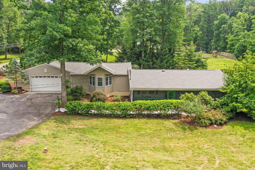 Welcome to your very own mountain paradise. Offering a unique opportunity to escape the hustle and bustle of everyday life while being conveniently located to the DC metro area. 

Whether you're seeking a personal retreat or an investment property, 895 Lower Clubhouse  Dr. will surely delight you. From the moment you enter the beautifully landscaped yard with 2 fences in the backyard for ultimate privacy, you know you are on a mountain retreat. This home has been fully updated by the current owners, including the gorgeous and spacious kitchen with stainless steel appliances and plenty of space for entertaining. Three Bedrooms, 2 Full Baths. The newly updated bathroom features a custom tiled walk-in rain shower, ambient lighting with surround sound, and radiant heat flooring. From the kitchen, walk up the beautiful 800 sq ft Family Room featuring individually hand-stained tongue and groove pine on the walls and celing, skylight, beautiful beams with lighting, custom window bench, surround sound, and large hearth with a wood burning stove to keep you cozy during the chilly nights. 

As if that wasn’t enough, step into your private fenced in backyard Oasis . Enjoy your morning coffee on the large deck, and in the evening relax in the hot tub. If  spending lazy afternoons lounging on the screened-in porch, where you can immerse yourself in the soothing sounds of nature while taking in the scenic beauty that surrounds you is more what you're looking for, the 462 sq foot screened-in porch is sure to provide that. Walking distance from the house is the coveted Lake Shannondale and Mountain Lake Club, where you can stroll and enjoy fishing, boating or just relaxing on the sandy beach. There is also a restaurant and frequent community events at the Lake Clubhouse. Membership isn't required to enjoy all of these amazing amenities. 

The two car garage and a paved driveway , will ensure that your guests have plenty of parking.  The systems that have been recently added or updated consist of the HVAC, water heater with expansion tank, water purification and water softener systems, well pump, new roof and extensive hardscaping and landscaping.   Conveniently located to historic districts of Harpers Ferry, local wineries & breweries, outdoor adventures, shopping, restaurants, casino and not to mention the accessibility minutes from Rte 9 making this a great commute to Northern Virginia and D.C. ALL OF THIS AND NO HOA FEES