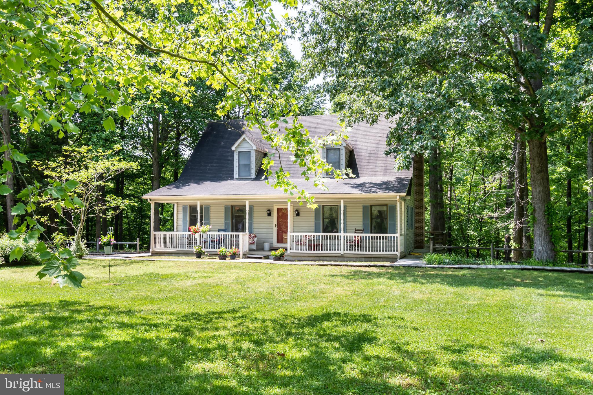 A lovely Cape Cod situated on 2 acres in High Banks. This 3 bed/2 bath home backs to the woods and overlooks a private 10 acre stocked pond. Sit on your large front porch and enjoy nature in this tranquil setting. Walk down to your pier, fish, kayak or canoe in The Pond at High Banks. The first floor consists of an eat in kitchen, formal dining room and large family room complete with a wood burning fireplace. An entry level bedroom and bath are located on the first floor. Upstairs, you will find two spacious bedrooms, a full bath along with two other rooms that could be used as an office or a sitting room. On the property you will also find a large shed/machine shop with electricity. Square footage actually closer to 2100 sq ft due to completion of two rooms upstairs