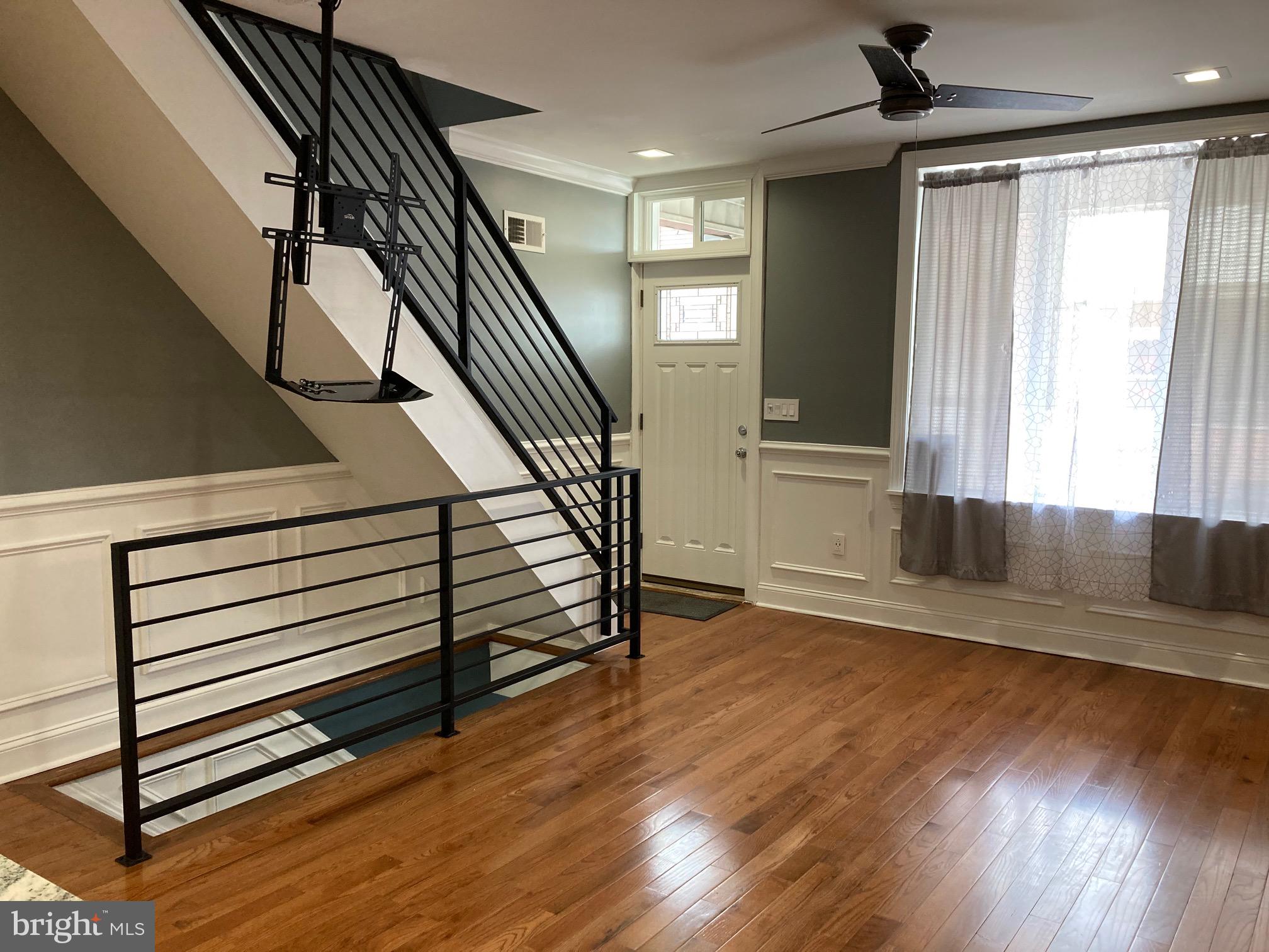 Welcome to 2445 S Lawrence Street — Your Dream Rental Home in South Philly! This beautifully updated end-unit row home is located in the heart of Whitman/Lower Moyamensing, one of South Philadelphia’s most vibrant and sought-after neighborhoods. With custom-designed touches throughout, this property seamlessly blends historic charm with modern luxury. Featuring 2 spacious bedrooms, 1 luxurious bathroom, and a fully finished basement, the home offers approximately 1,500 total finished square feet. Step inside to an open-concept layout with exposed brick accents, gleaming hardwood floors, stainless steel appliances, a farmhouse kitchen sink, and built-in closet space in both bedrooms. The customized bathroom includes a jacuzzi tub, walk-in shower with built-in bench, and exposed brick for a warm, rustic touch. Downstairs, the fully finished basement boasts porcelain tile flooring, bonus living space perfect for a home office, gym, entertainment zone, or personal retreat, and a separate laundry room with stackable washer/dryer and additional storage. Prime location highlights include easy access to public transportation, major highways, and bridges, minutes from local shopping, and a quick ride or walk to the Sports Complex and nearby parks/schools. Whether you're working from home, commuting, or just looking to enjoy everything South Philly has to offer — this home delivers. Schedule your private showing today!