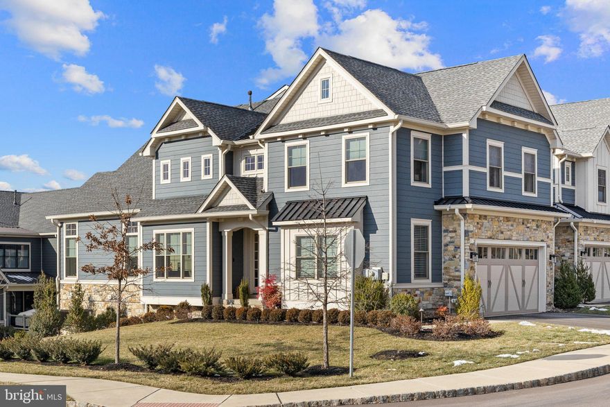 Don’t miss out on this stunning 3-bedroom, 2.2-bathroom newly built and never lived in model carriage home that is walking distance to the town of Ambler! Nestled in the desirable Mattison Estate, this meticulously upgraded carriage house offers an open floor plan and exceptional attention to detail throughout. Step into the grand front foyer, where rich wood floors span the entire home, creating a warm and inviting ambiance. To the right, a private office awaits, featuring French doors, upgraded crown molding, a tray ceiling, and large windows that flood the space with natural light. The adjacent dining room is the perfect setting for intimate gatherings, enhanced by built-in surround sound for an immersive experience. The heart of the home is the expansive family room, boasting a cathedral ceiling, a gas fireplace framed by charming shiplap, and floor-to-ceiling windows that provide picturesque views of the outdoors. Seamlessly connected to the family room, the chef’s kitchen is a true showstopper. It features an oversized island with seating, quartz countertops, upgraded ceiling-height cabinetry, a built-in range, and a bar area complete with a wine fridge and tiled backsplash. Sliding doors lead to a maintenance-free deck overlooking a private, fenced-in yard ideal for relaxing or entertaining. Upstairs, the primary suite is a luxurious retreat, complete with a tray ceiling adorned with shiplap and wood beams, custom shutters, and his-and-her walk-in closets with custom fittings. The spa-like ensuite bathroom features a double vanity, a large tiled shower with a rain shower head and glass slider, and a separate water room. Two additional bedrooms offer cozy carpeting, generous closets, and easy access to the hall bathroom, which includes a double vanity and a tiled tub-shower combination. A second-floor laundry room with tiled flooring adds convenience to everyday living. The finished walk out basement is ideal offering wood and tile floors, a gas fireplace with a stunning stone surround, a half bath, storage areas, plus ample lighting making it perfect for recreation or hosting guests. Other benefits are the attached  two-car garage,  upgraded trim work, built-in surround sound, a ton of additional upgrades as well as a blend of classic and contemporary finishes. Mattison Estate sits on the picturesque grounds of the historic Lindenwold Estate and is within walking distance to Ambler Borough and blends the elegance of the estate’s history with modern architecture, superior craftsmanship, and custom design, making it a truly one-of-a-kind living community! Close to public transportation and conveniently situated in the award winning Upper Dublin School District.