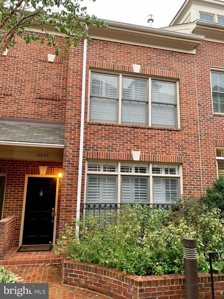 WELCOME HOME!! Absolutely STUNNING, extensively  UPDATED 4-Level brick, Federal Style townhome in desirable Highgate*Owners have spared no expense in updating & renovating this gorgeous home*Remodeled living room w/floor to ceiling custom mantle w/Gas fireplace; plantation blinds; recessed lighting and speakers*Large dining room w/elegant lighting*Expanded & updated Chef's kitchen with custom cabinets; upgraded counters; gas cooking; stylish back splash; stainless appliances; built-in pantry & storage; wine fridge; center island; and walk-out to serene/secluded slate patio for outdoor enjoyment*Main level also boasts wide-plank wood floors; crown molding; and powder room*Walk up to the 2nd level to find a master bedroom retreat like no other featuring vaulted ceilings; hardwood floors; plantation blinds; and a custom designed, loft master closet. The master BR also has one of the most elegant bath's you will see in a townhome w/custom flooring & tile; extra-large walk-in shower w/frameless glass; separate soaking tub w/jets; vanity w/double sinks + custom fixtures & lighting*There is an additional large bedroom w/hall bath at the 2nd level*The 3rd level is being used as a 3rd guest bedroom, but can be used as a home office/exercise room*The lower level has a cozy recreation room as well as a large laundry room*Walk-out from this level to your private, secure, 2-car garage*This sought after location is only 2 blocks to the Rosslyn Metro, yet in a secluded oasis. Being in the heart of the city is easy access to Georgetown, Clarendon, Courthouse, DC, bike trails & top local amenities*Walk to shops, restaurants, grocery*Short drive to Amazon HQ2, Pentagon, Old Town Alexandria, Airport, and so much more.