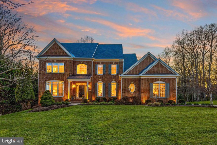 EQUITY HOMES signature Lancaster 1 model, sited beautifully on a PREMIUM 1.1 acre lot in Silkwood, is for sale by the original owners.  This Colonial offers three finely finished levels with over 6000 square feet of living space. The 2-story arrival area opens to a formal living room to your left and a formal dining room to your right.  A private office is smartly tucked away behind the recessed staircase. The rear of the home is devoted to a TRUE chef's kitchen with a butler's pantry, a large casual dining area, a computer work area, a large family room and access to a private deck overlooking the open yard bordered by trees, trees and more trees.  The upper level houses 4 bedrooms and 3 full bathrooms.  Each bedroom has a walk-in closet.  Bedrooms 3 and 4 share a bathroom with dual vanities.  The primary suite overlooks the rear yard and is complete with an alcove for morning coffee and a true spa bath.  Head to the walk-out lower level and you will find a welcoming bar area, a game room (pool anyone?) an entertainment room if you so desire or a 5th bedroom. Yes, there is a full bath! Don't miss the home fitness center.  Some of the general amenities include: hardwood flooring, 10 foot ceilings on the main level and 9 foot on the other, custom architectural moulding throughout the home, arched entryways,  floor to ceiling windows with transoms (which fill this home with an abundance of soft light).  There is recessed lighting, ceiling fans, gas fireplace (in the family room), a center island in the kitchen with granite countertops, under cabinet lighting in the kitchen as well.  The laundry is on the main floor. The front of the home is brick with Hardi-Plank sides and rear. There is landscape lighting and an irrigation system for the mature landscaping. The deck as mentioned is huge and a level below is a blue-stone - stone patio with a sitting wall creating outdoor living when the weather permits. Not to be overlooked is the desired, large 3 car side-load garage. This country house for the city mouse is tucked between two metro stations. I 66 is minutes away as are the shops of Oakton and Vienna.