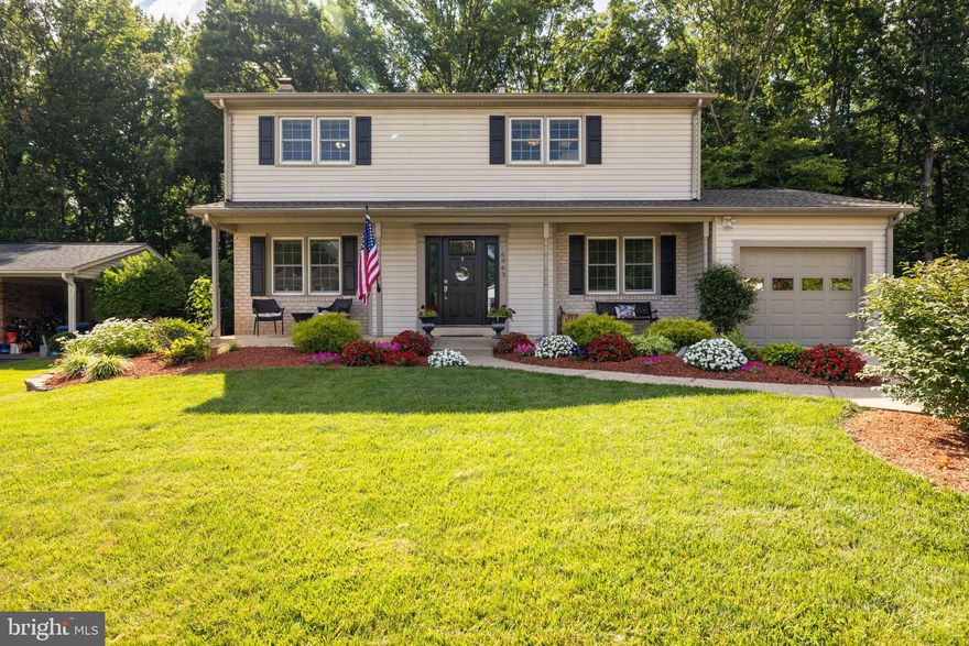 This meticulously maintained home welcomes you at first sight.  The covered front porch beckons you to take a seat.  Premium lot - lush, green grass, actual flat space AND backs to woods.   This  4 bedroom, 2 and a half bath home with one car garage is ready for you to move in.   Upon entering, you will notice a feeling of calm.  Hardwood floors and custom paint throughout the home.  Curl up in front of the gas fireplace in the living room or join in with everyone else in the expansive 38' x 12' family room addition.  This house gives you everything you need to include an office space on the main level.  
You're sure to create many memorable meals in the gourmet kitchen.  A GE 5 burner gas stove, Bosch dishwasher, deep double porcelain sink, coffee bar,  and tons of granite counter space make it  easy for more than one cook at a time.  The breakfast bar seats 5.    Light fills the family room from newer windows and three skylights.  A lovely counter and wine fridge make this space very comfortable.   An Andersen slider opens to the deck.  The deck runs the length of the house offering plenty of space for entertaining.  The lawn meanders down toward the woods connecting to walking trails.  There is also  a hot tub (2023) with privacy fence and  a 12'x12' she shed/man cave. that has plenty of storage and electricity.      All bedrooms have hardwood floors and ceiling fans.  All bathrooms have been remodeled and updated.  Primary bath has XL shower. Laundry chute!  Lower level has a 250 sq ft finished  bonus room with dry bar and wine fridge. The rest of the basement is currently being utilized as an exercise room, laundry area and storage with shelves .NEW custom paint on main level 2022 NEW roof 2019, NEW front door 2020, NEW HVAC 2020,. Hot water heater 2016.  Close to major commuter routes Fairfax County Pkwy, 495, 95 and 66.  West Springfield HS Pyramid and German Immersion Program at Orange Hunt Elementary  OPEN HOUSE  on Sunday 16 JUL 1-4 PM.
