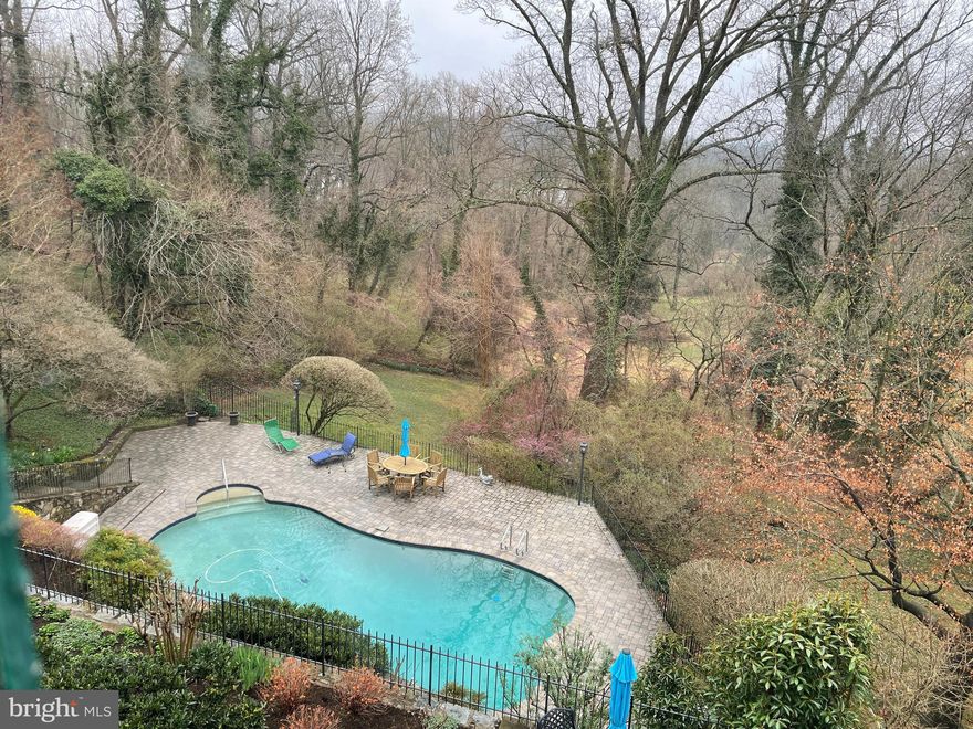 Very rare offering on upper part of Chain Bridge Road, high vistas of the parkland with terraced gardens and outdoor pool.  Large wood paneled living room with fireplace, Dining room overlooks the park, gourmet eat in kitchen and glorious screen porch on first level.  3 Bedrooms and 2 baths on second floor, Bedroom plus sitting area and full bath on third floor.  Basement level features classic paneled family room with fireplace, laundry area, wine cellar and access to heated two car garage. The gardens are beautifully manicured with specimen trees surrounding.  You feel as if you are in the countryside, yet walk to restaurants, 1 mile to Tenley metro and 15 minutes drive to Reagan Airport.  This is a very special house.     Home Improvements include: