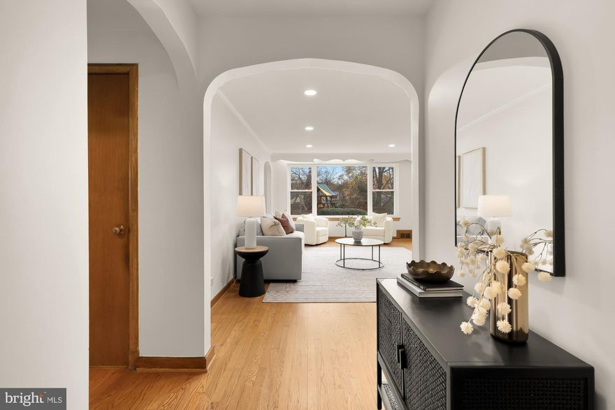 Welcome to this captivating residence nestled in the heart of Woodside Park, where timeless character meets modern comfort. This incredible home offers an inviting blend of charm, warmth, and functionality, designed to make everyday living feel connected, calm, and effortlessly comfortable.

Step inside to a sunlit interior filled with natural light and original architectural details. Beautiful hardwood floors, arched doorways, and oversized picture windows create an airy flow throughout the main level. The spacious living room is filled with warmth, anchored by a striking wood burning fireplace, and opens seamlessly to the formal dining room, making the home ideal for both quiet evenings and lively gatherings.

Just off the kitchen, the owners added a beautiful light filled addition that serves perfectly as a dedicated home office, reading room, or creative nook. This thoughtful space enhances the home’s connection to the outdoors and offers a peaceful setting for work or relaxation.

A charming screened in porch extends the living space and provides a serene place to enjoy the surrounding landscaping year round. Whether sipping coffee in the morning or unwinding in the evening, this space feels like a natural extension of the home.

The lower level expands your living options with a beautifully finished basement featuring a spacious recreation room, a full bathroom, and a versatile flex room ideal for guests, a gym, or a studio. This level also offers abundant storage and convenient walk out access.

Outside, the property continues to shine. Mature trees and plantings create a sense of privacy and tranquility, enhancing both the front and rear yards. The rare two car tandem garage offers exceptional versatility, functioning equally well as parking, a DIY workshop, a home yoga space, or a hybrid of all three.

All this comes with unbeatable convenience just minutes to downtown Silver Springs vibrant shopping, dining, and entertainment including the AFI and Majestic Theatres, Saturday Farmers Market, The Fillmore, Whole Foods, and MOMS Organic Market. Commuting is effortless with nearby Silver Spring and Forest Glen Metro stations, future Purple Line stations, and bus stops.

Experience the perfect balance of suburban tranquility and urban convenience in this exceptional Woodside Park home.