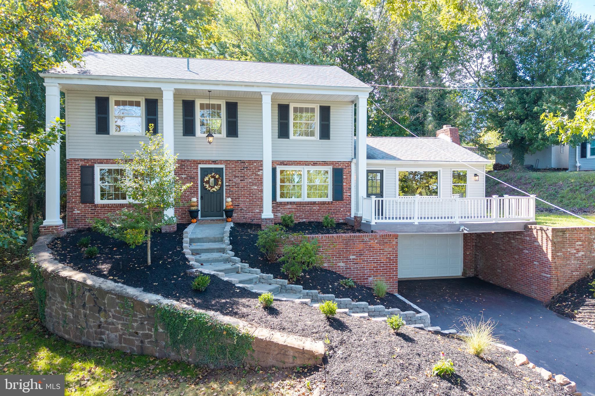 Perched on a private, over 1/2 acre, with sweeping Chester County views, 128 Forge Hill Lane in the highly sought-after Schuylkill Township is a fully renovated colonial that offers an amazing location and move-in ready luxury. Sunlight pours into every room, highlighting the new white oak luxury vinyl plank floors that run throughout the home, recessed lighting, and carefully designed spaces that make this home feel open, bright, and effortlessly inviting. The expansive designer kitchen, featuring quartz countertops, sleek cabinetry, and a breakfast area, flows into a huge family room with a large fireplace and a walkout deck that provides breathtaking views of Chester County—ideal for entertaining, hosting parties, or simply relaxing with family and friends. Adjacent to the kitchen, a sun-drenched sunroom with three sets of sliding doors overlooks a private, serene, and expansive backyard, creating an indoor-outdoor living experience that is both versatile and inspiring. Public water and sewer allow for endless possibilities in the backyard, from adding a pool to creating expansive outdoor living areas for dining, recreation, and celebrations. The front living room includes another wood-burning fireplace and could easily serve as a first-floor office, library, sitting room, or anything you desire. It could also be converted into a first-floor large bedroom with another full bath, with the current owners willing to collaborate with a buyer on that option. With so much space on the first floor, the possibilities are virtually endless, offering unmatched flexibility for your lifestyle. With its open, flowing layout, the entire first floor is tailor-made for entertaining large groups, holiday gatherings, or casual get-togethers, ensuring there are no cramped spaces—just wide, welcoming areas where guests can mingle comfortably. The formal dining room provides an elegant setting for intimate meals. Upstairs, the primary ensuite is a tranquil retreat featuring a designer walk-in shower and generous closet space. Three additional bedrooms share a brand-new full hall bath, and a convenient upstairs laundry area adds to the home’s functionality. Additional highlights include: new water heater installed 09/2025, well-maintained landscaping, a two-car attached garage with extra covered parking, and a new finished basement that is perfect for a home gym, workshop, office, or additional bedroom. Previous owner indicated that the roof and windows were replaced in the last 10 years. The location is unmatched: just minutes from Valley Forge Park and only 5 minutes from downtown Phoenixville, with easy access to King of Prussia, Chester Springs, West Chester, major highways, Route 422, and SEPTA. This home offers the rare combination of living in an established, highly sought-after area while enjoying a fully renovated, spacious residence designed for entertaining, family gatherings, and everyday fun. From the open, flowing spaces to the sun-filled rooms, expansive backyard, and breathtaking views, 128 Forge Hill Lane isn’t just a house—it’s a lifestyle and a rare opportunity to own a sun-filled entertainer’s dream in the heart of Schuylkill Township for under a million dollars. Truly, a one-of-a-kind gem you don’t want to miss. Check out the virtual tour and schedule your showing today!